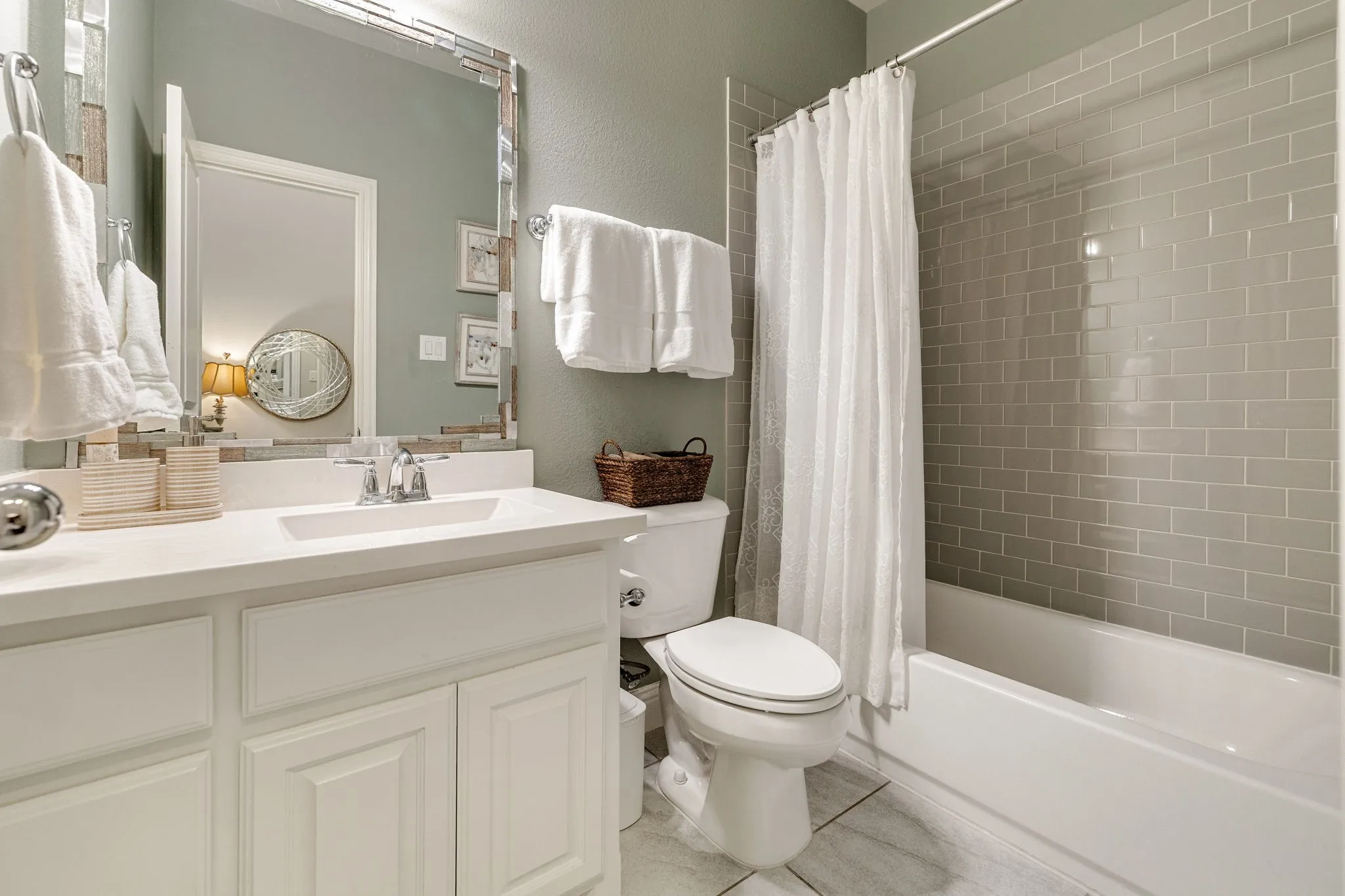 Downstairs secondary full bath with tub/shower combo.