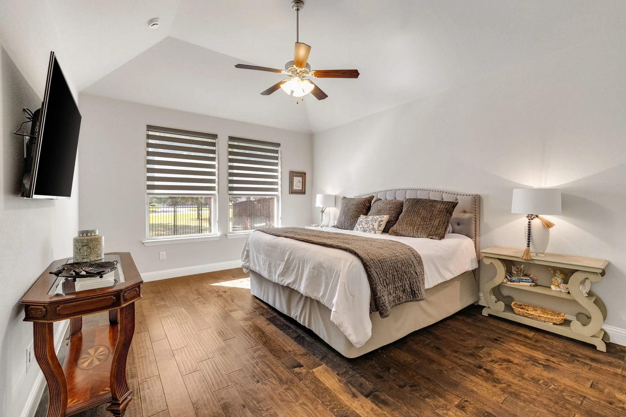 Primary suite overlooking the back yard and green space.