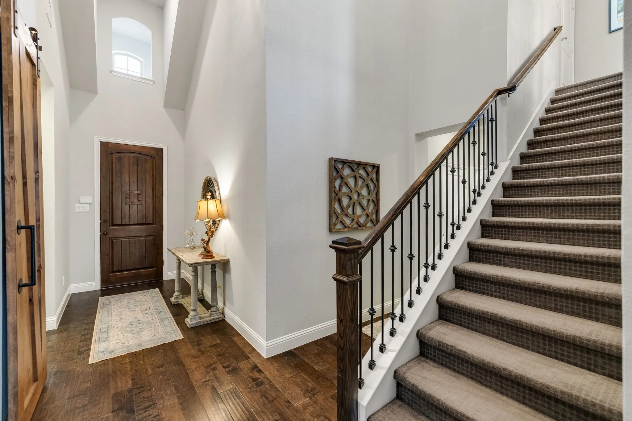 Entry boasts soaring ceilings.