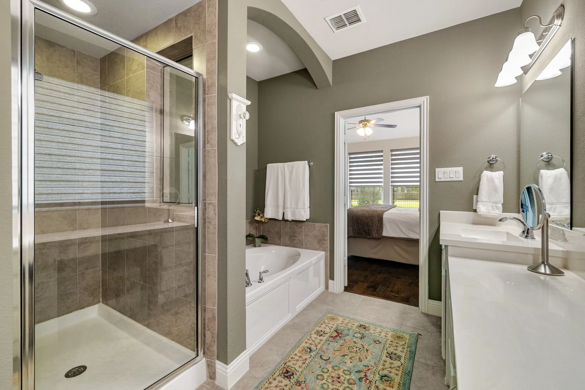 En-suite bath features soaking tub and oversized shower.