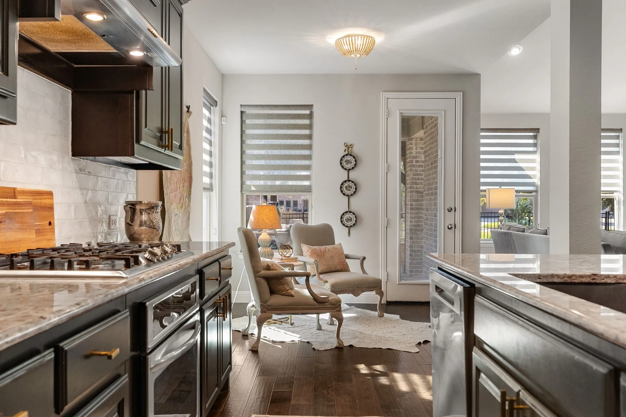 Kitchen with under-cabinet lighting and gas cooktop.