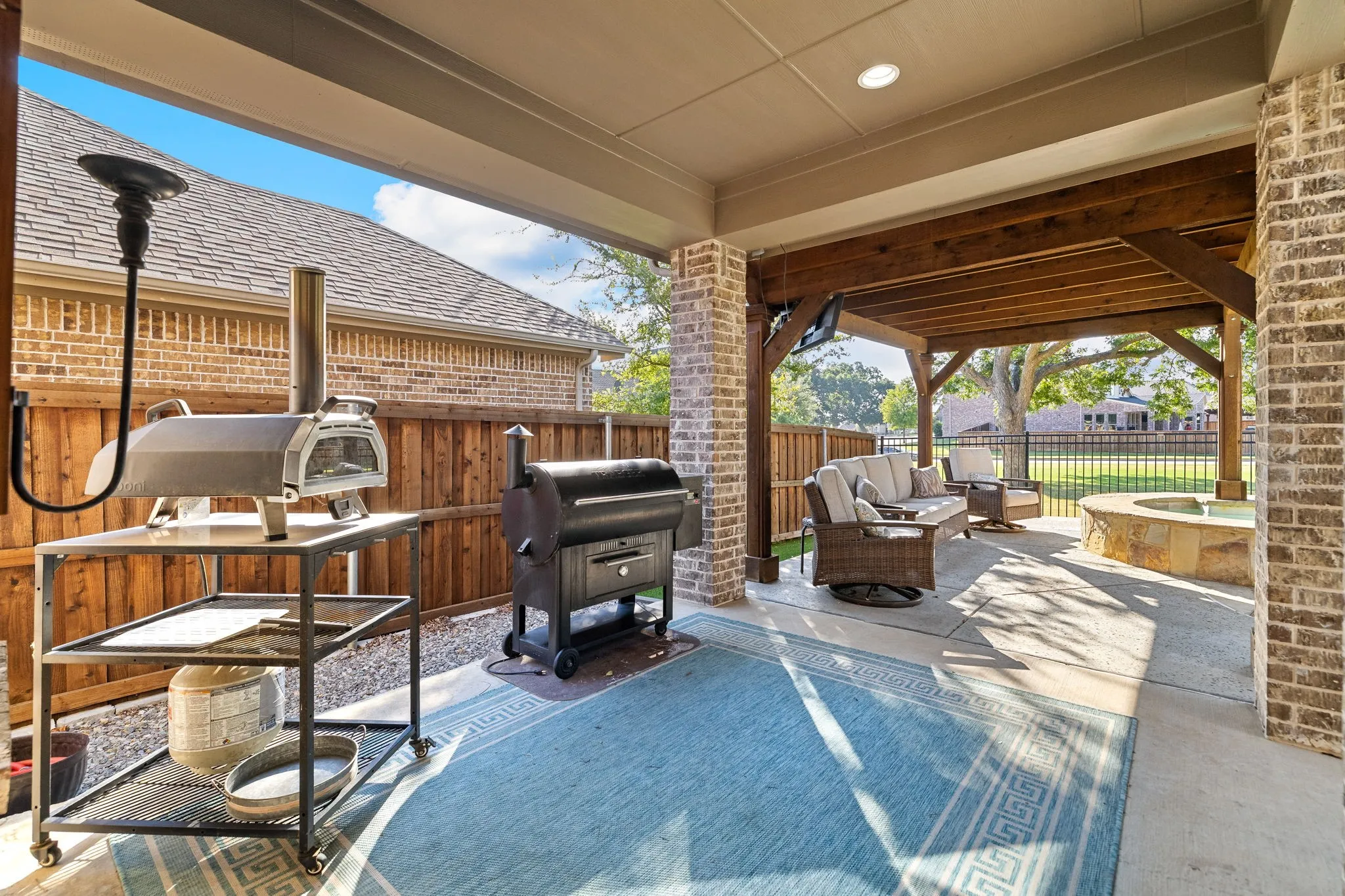 Outdoor covered patio with extended pergola patio.