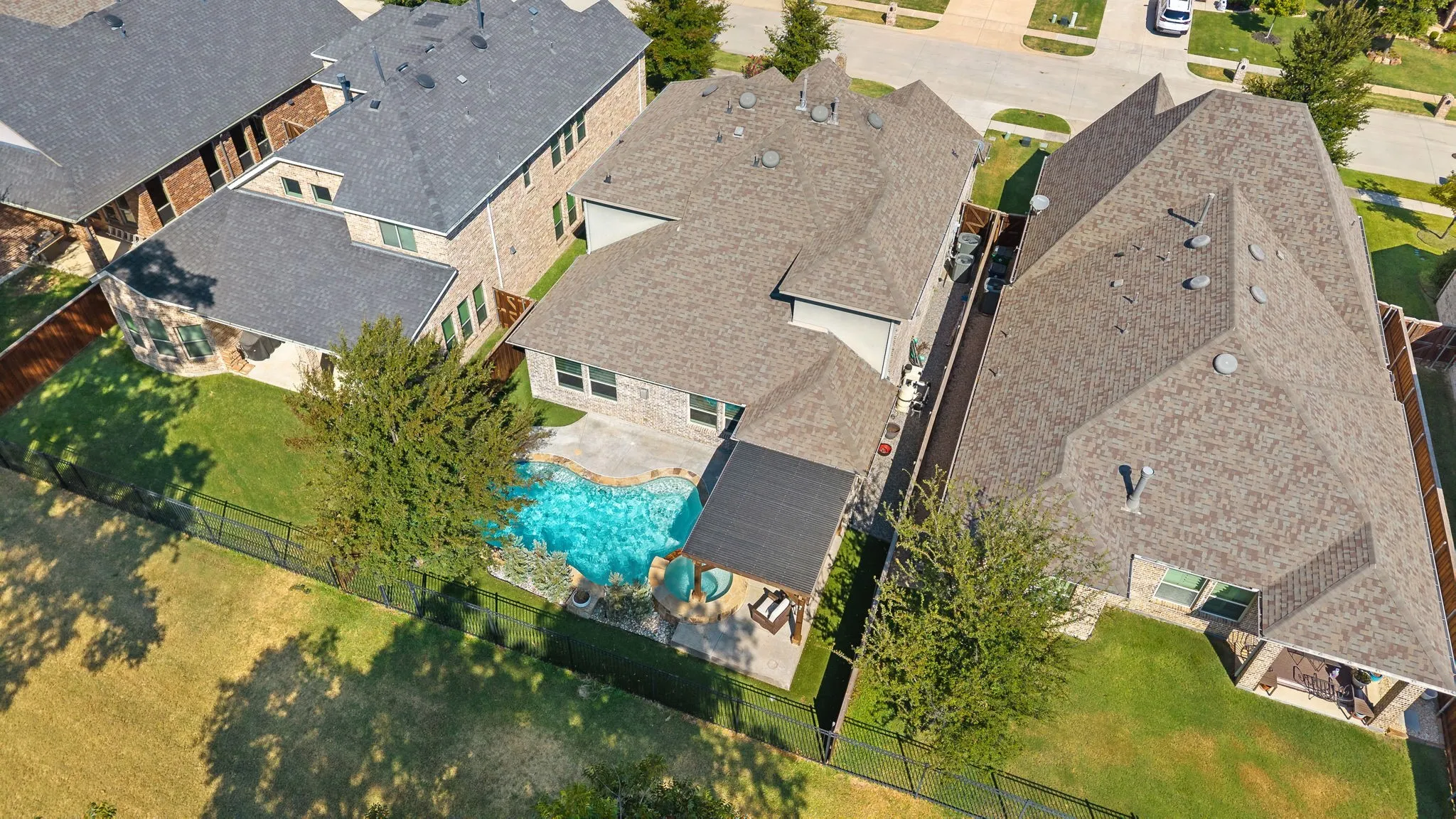 Aerial view of home showcasing backyard.