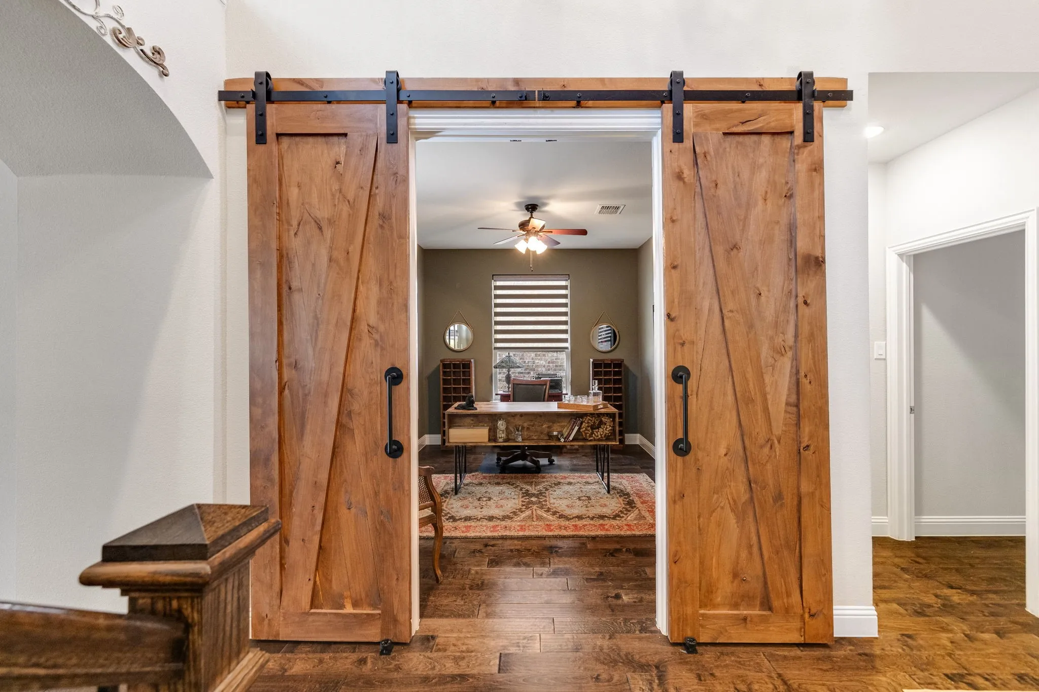 Office features barn doors entry.