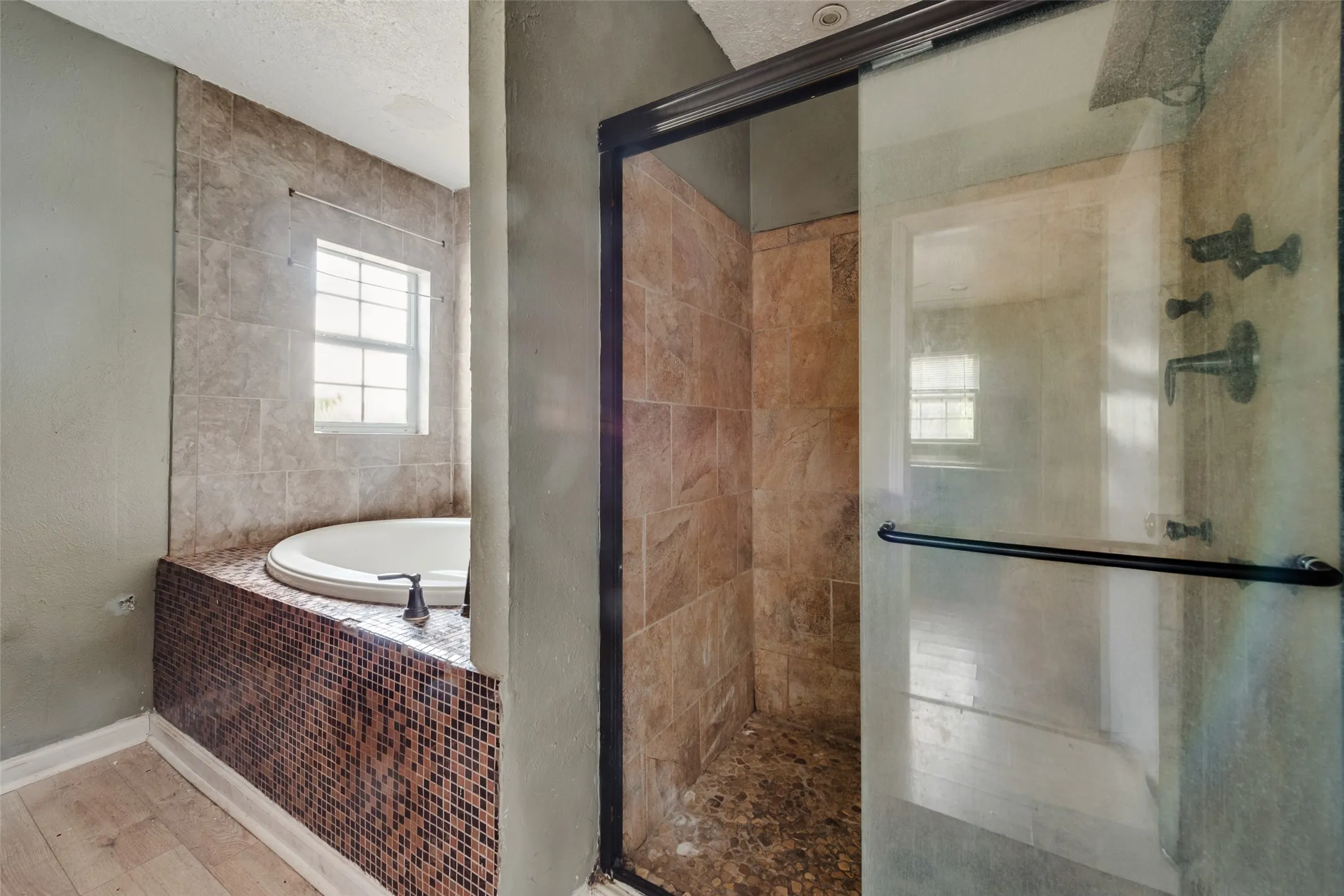 bathroom with garden tub and seperate shower