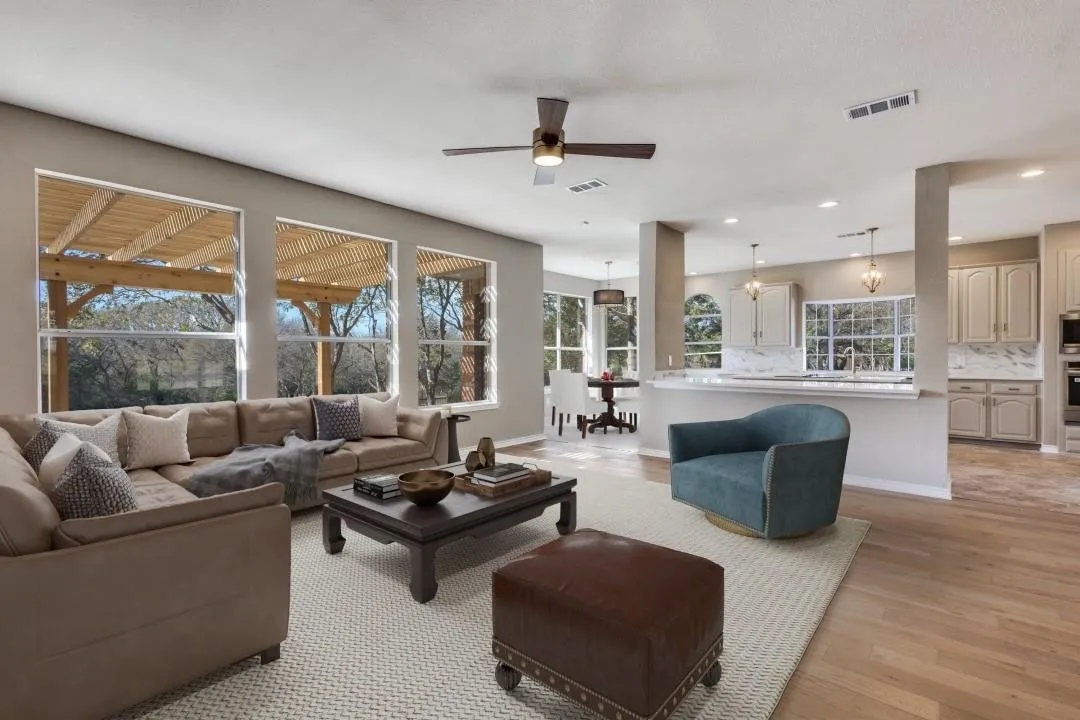 2nd Living room overlooks the pool and the golf course.Virtually staged