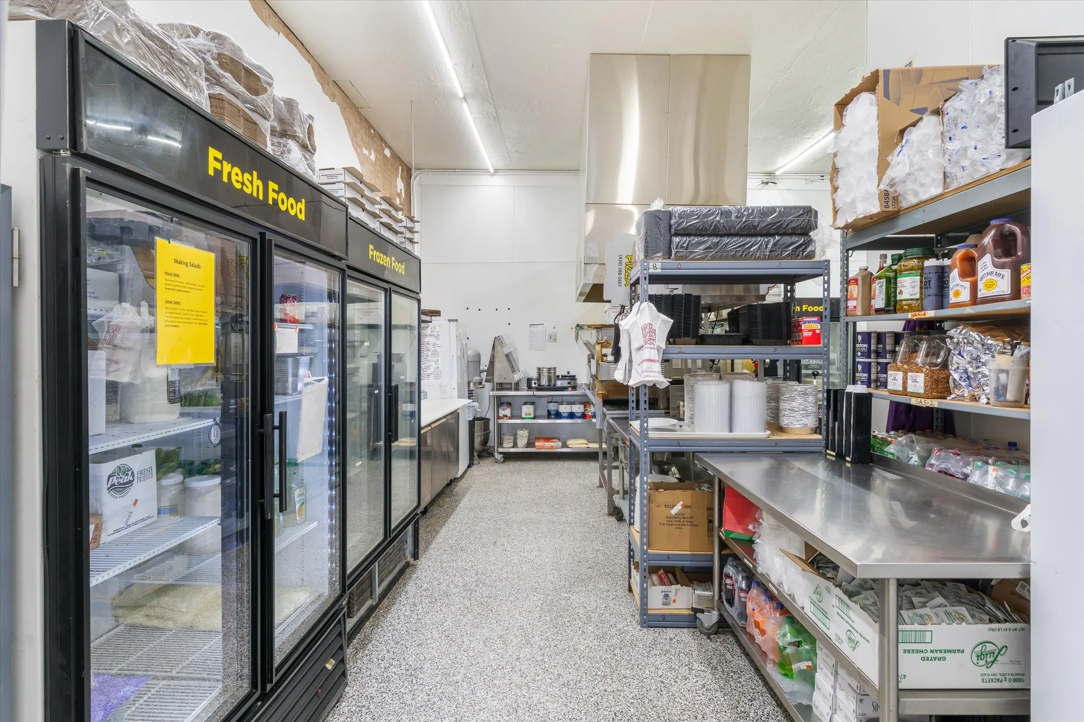 two large coolers, freezers stainless shelving