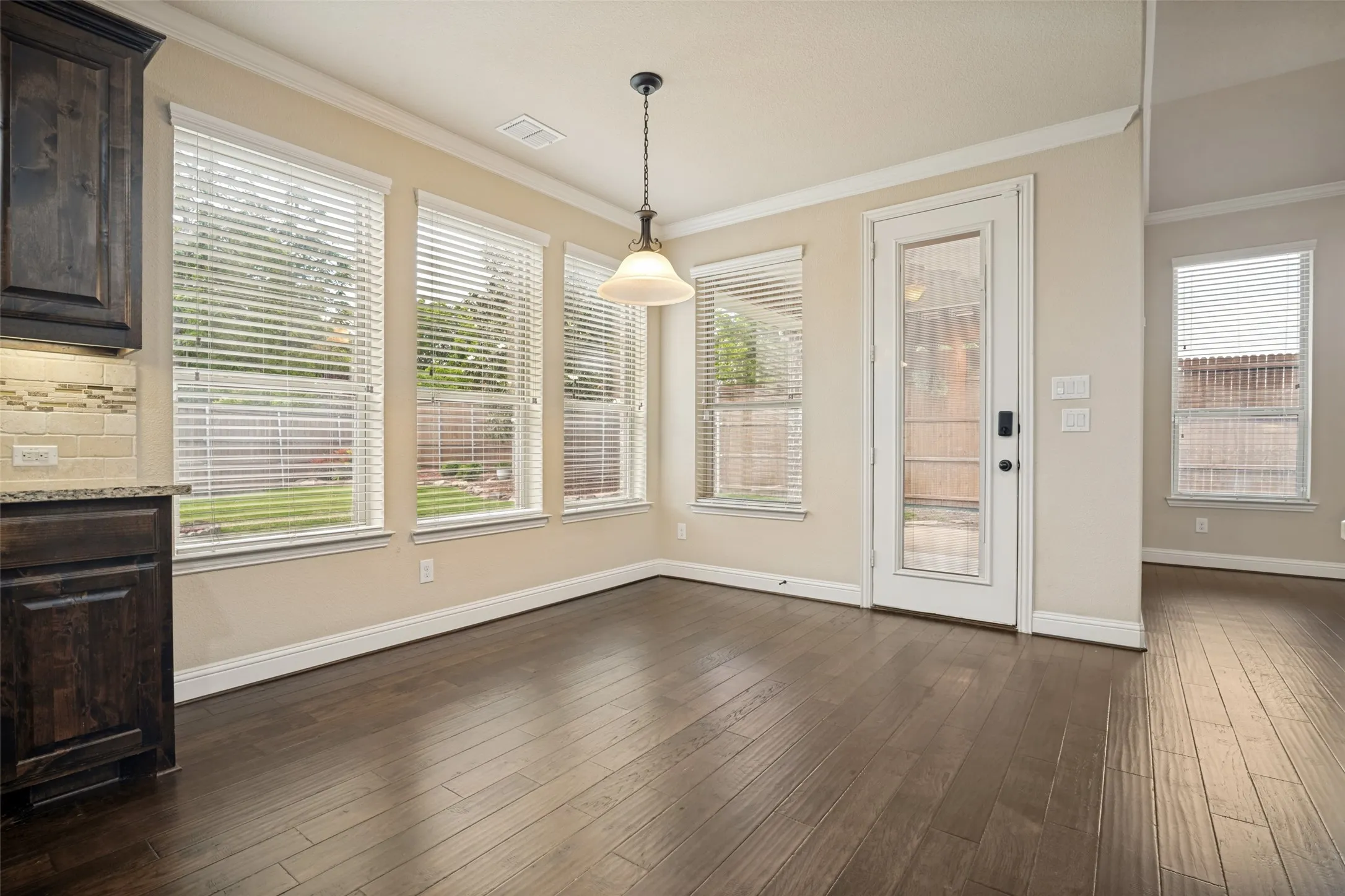 Breakfast area with access to patio and backyard.