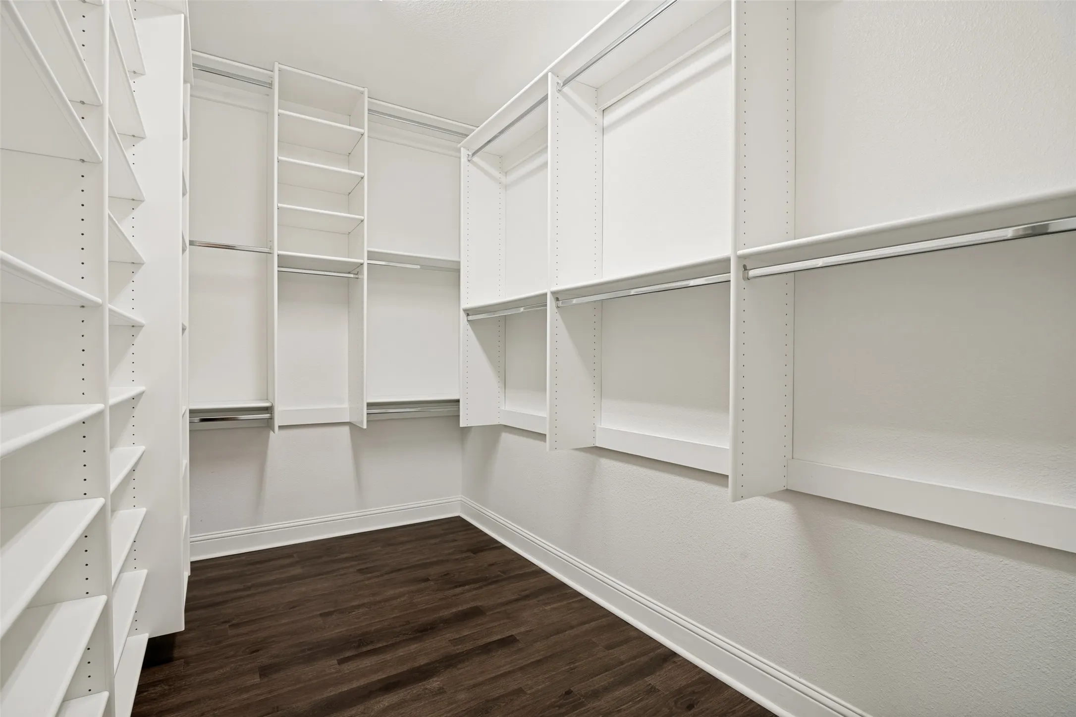 Custom closet system in enormous primary closet.