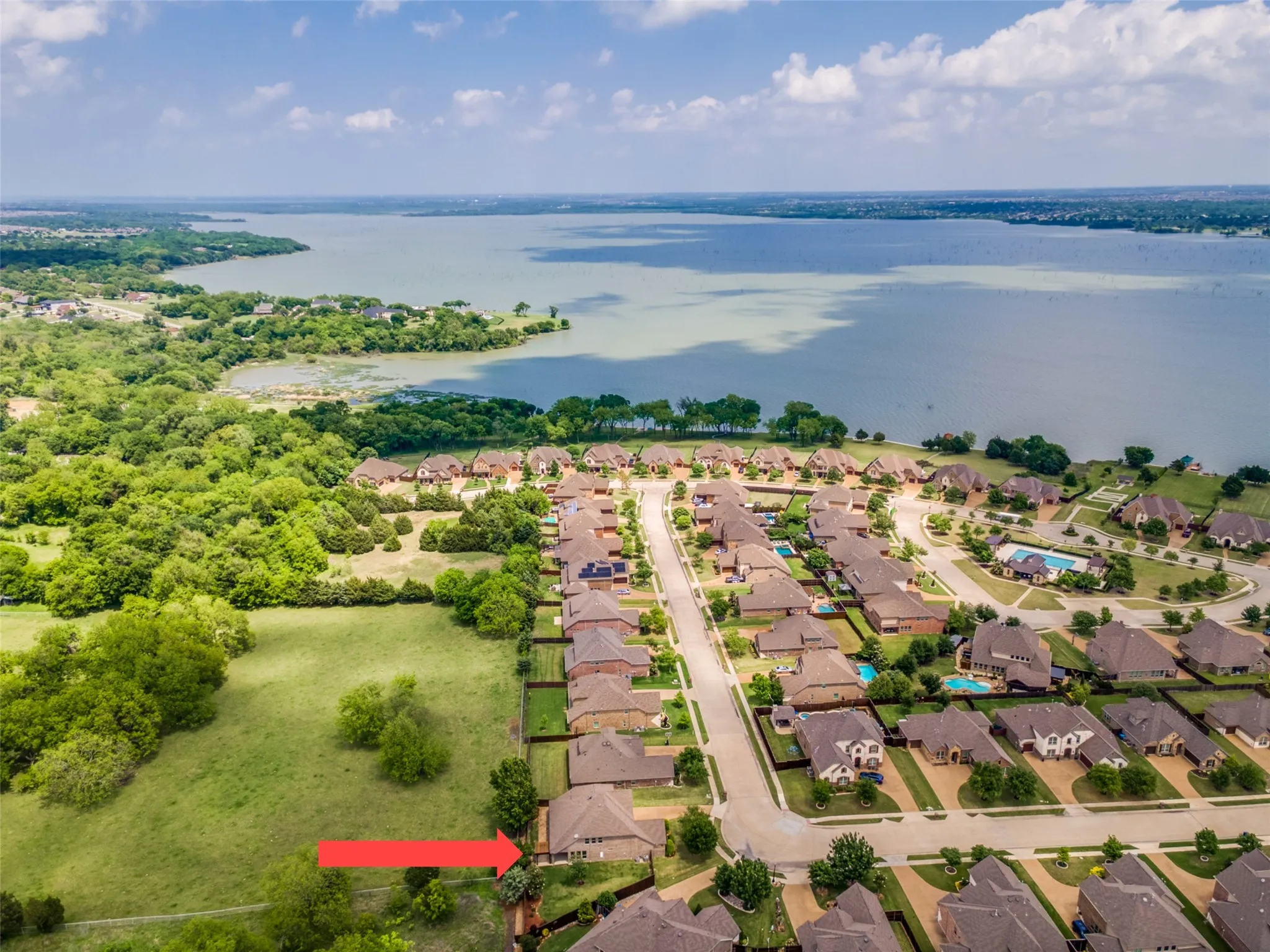Aerial view of Waters Edge neighborhood showing Lake Ray Hubbard in background.