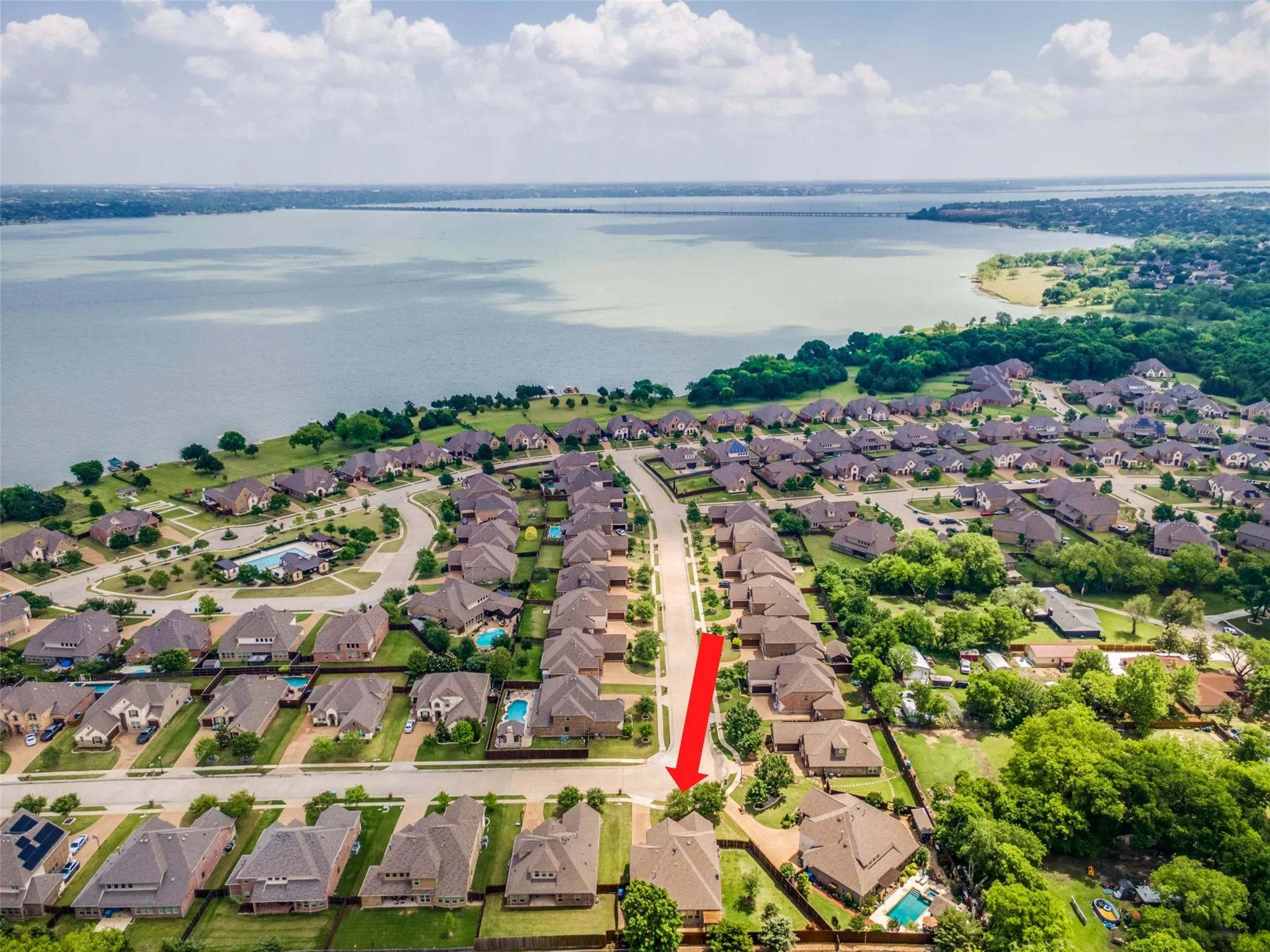 Aerial view of Waters Edge neighborhood showing Lake Ray Hubbard in background.