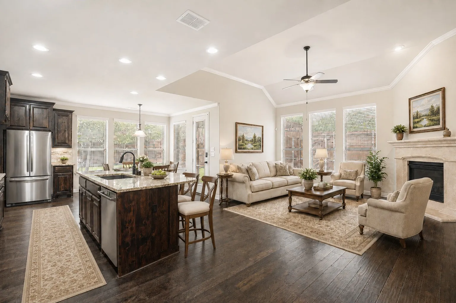 Open plan living area, kitchen, and breakfast area (virtually staged).