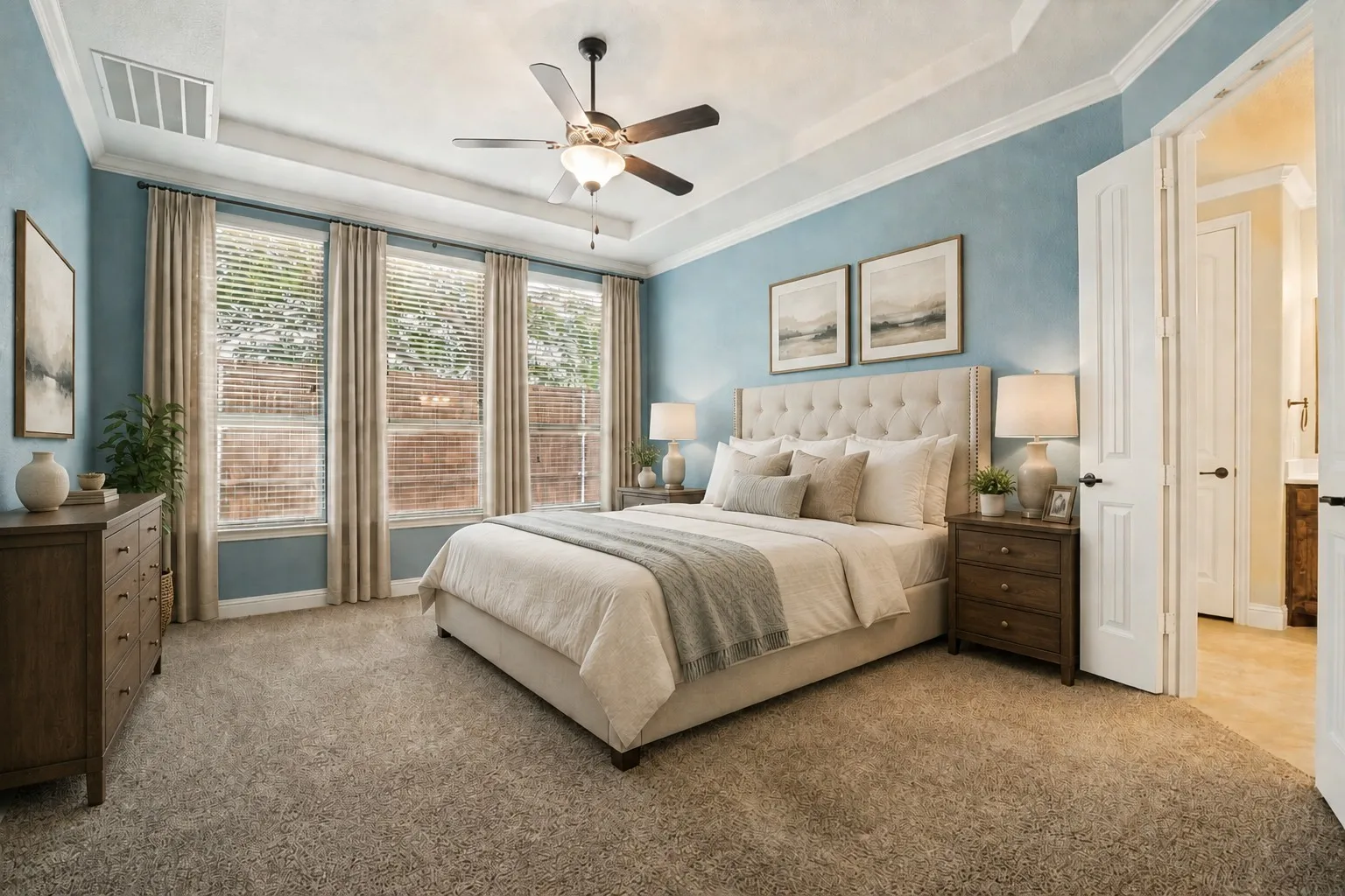 Spacious first-floor primary bedroom (virtually staged).