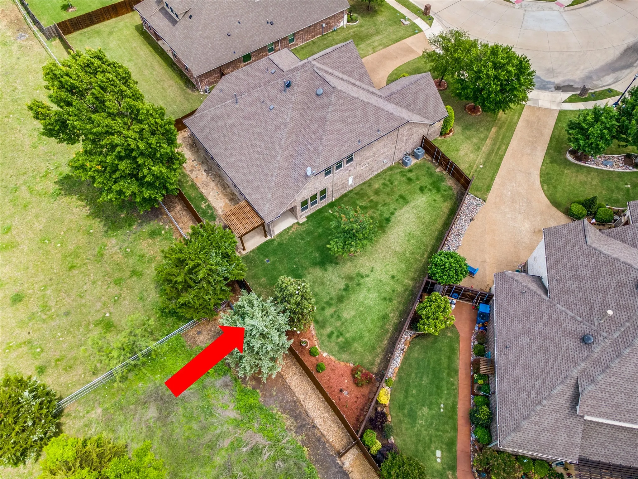 Aerial view of property from the rear showing pasture.