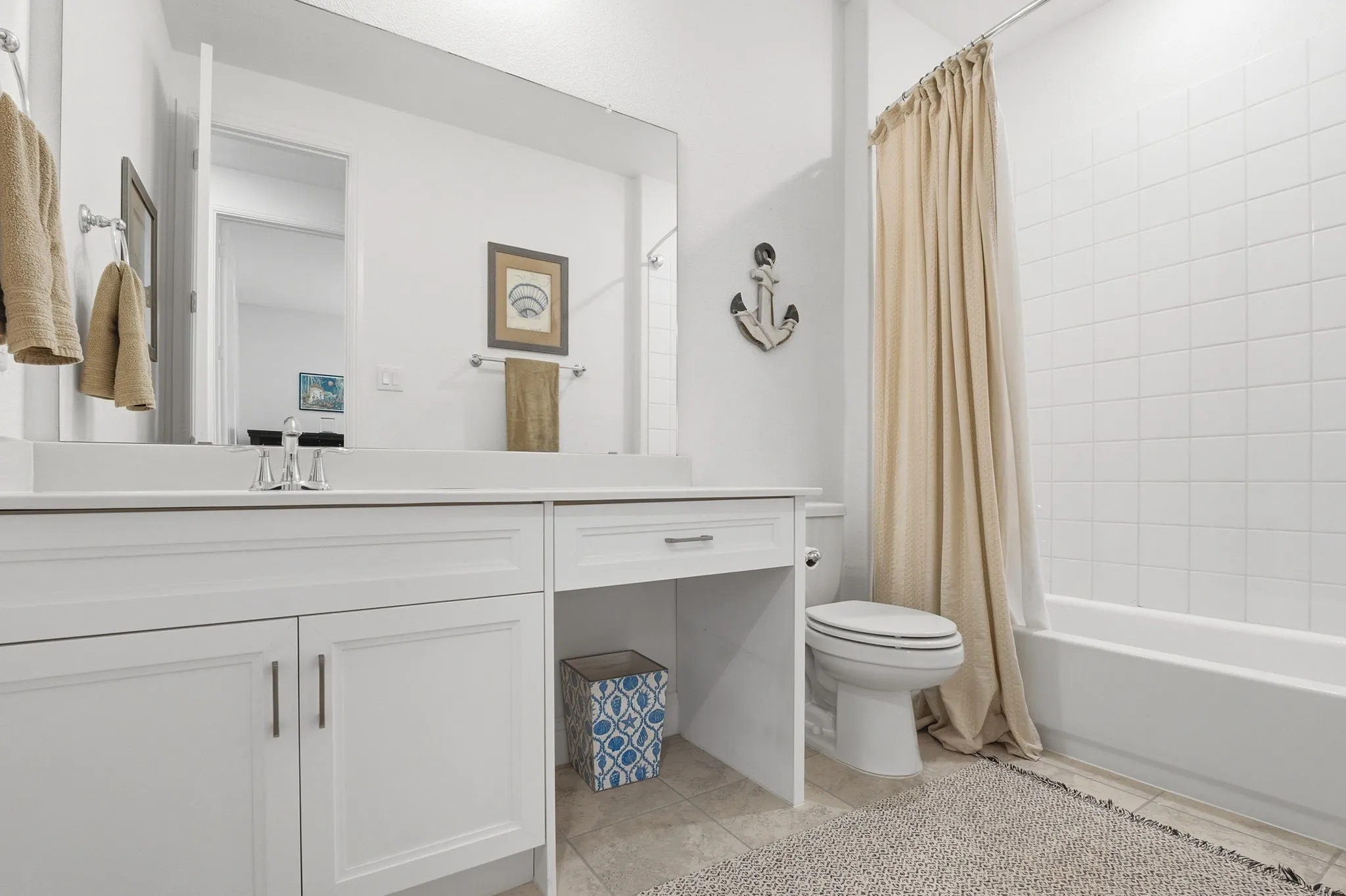 Full bath featuring a knee space services the two first floor secondary bedrooms!