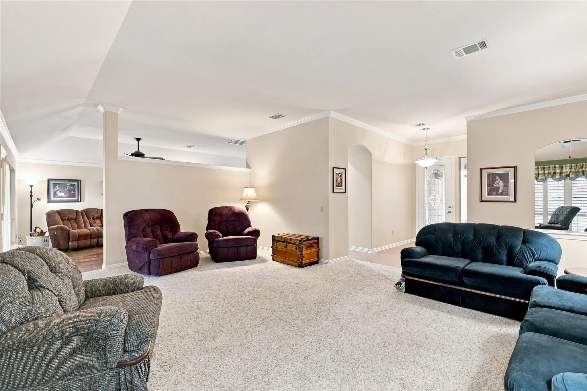 Light-toned carpeting throughout the main area