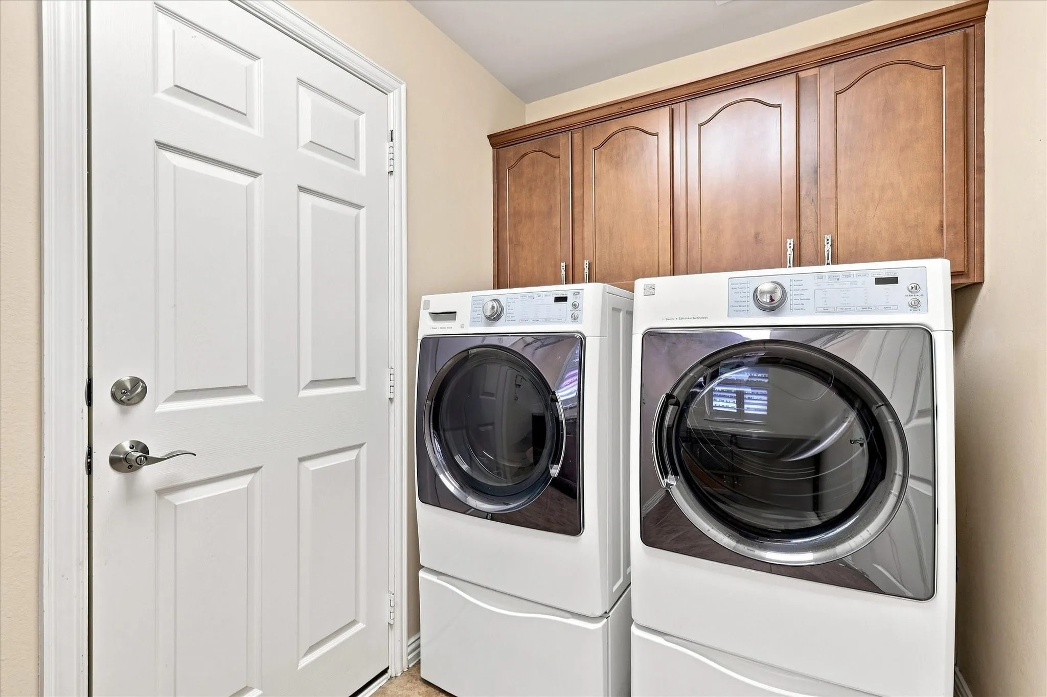 Laundry room with extra storage cabinets