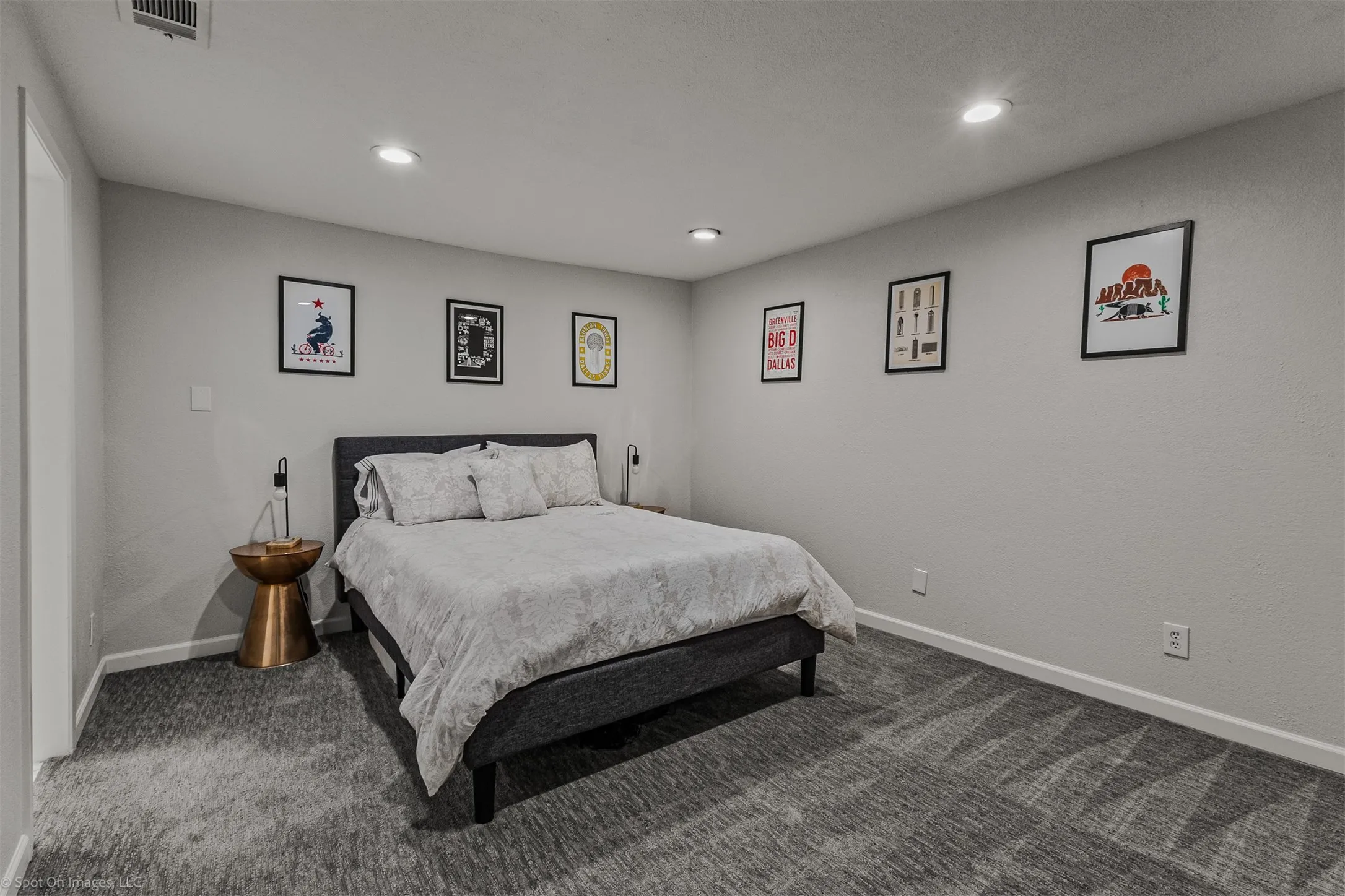 Recessed lighting, light gray wall paint, patterned gray carpeting, white trim, and a white ceiling