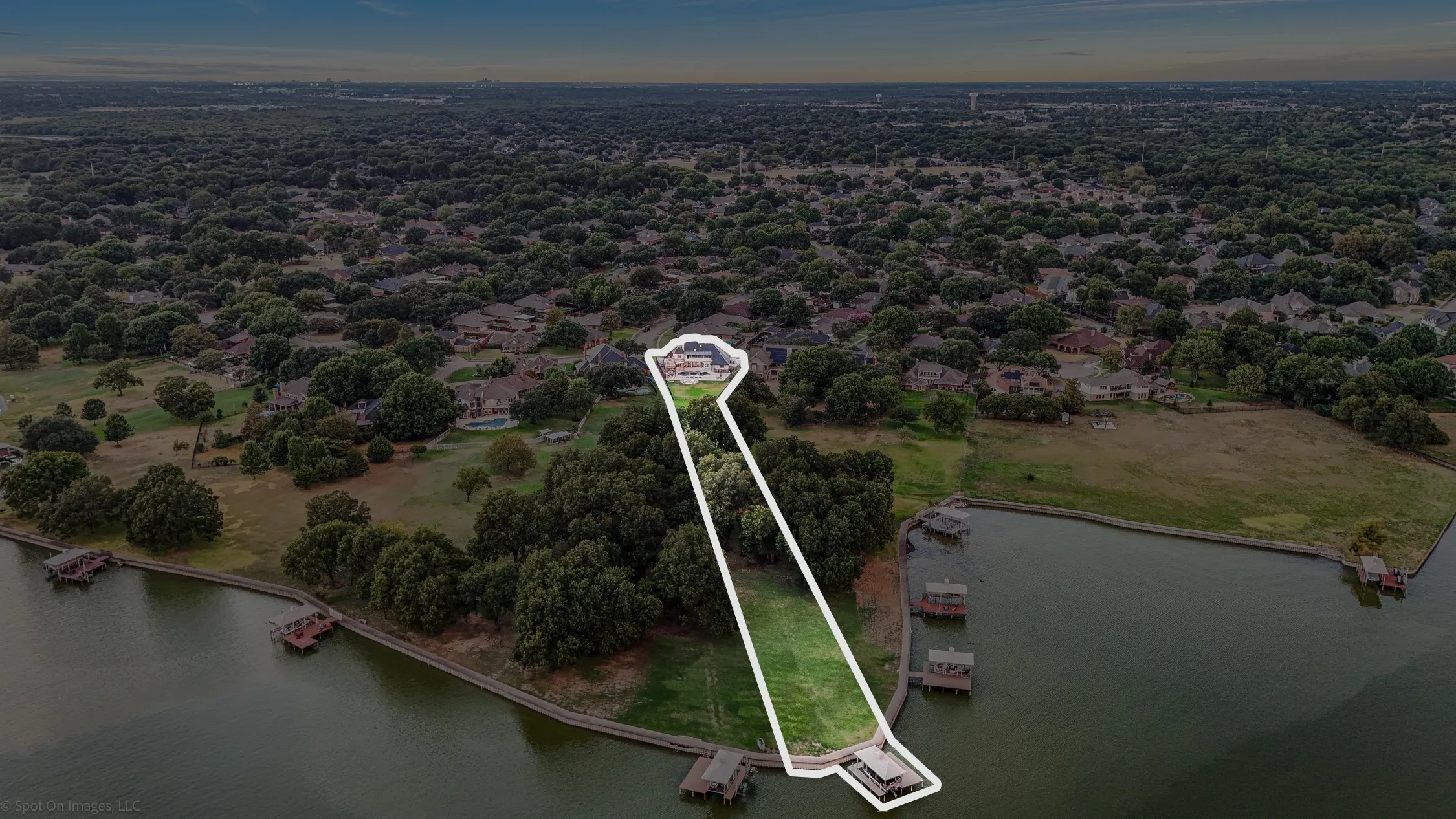 Waterfront property with private boat dock and expansive green space