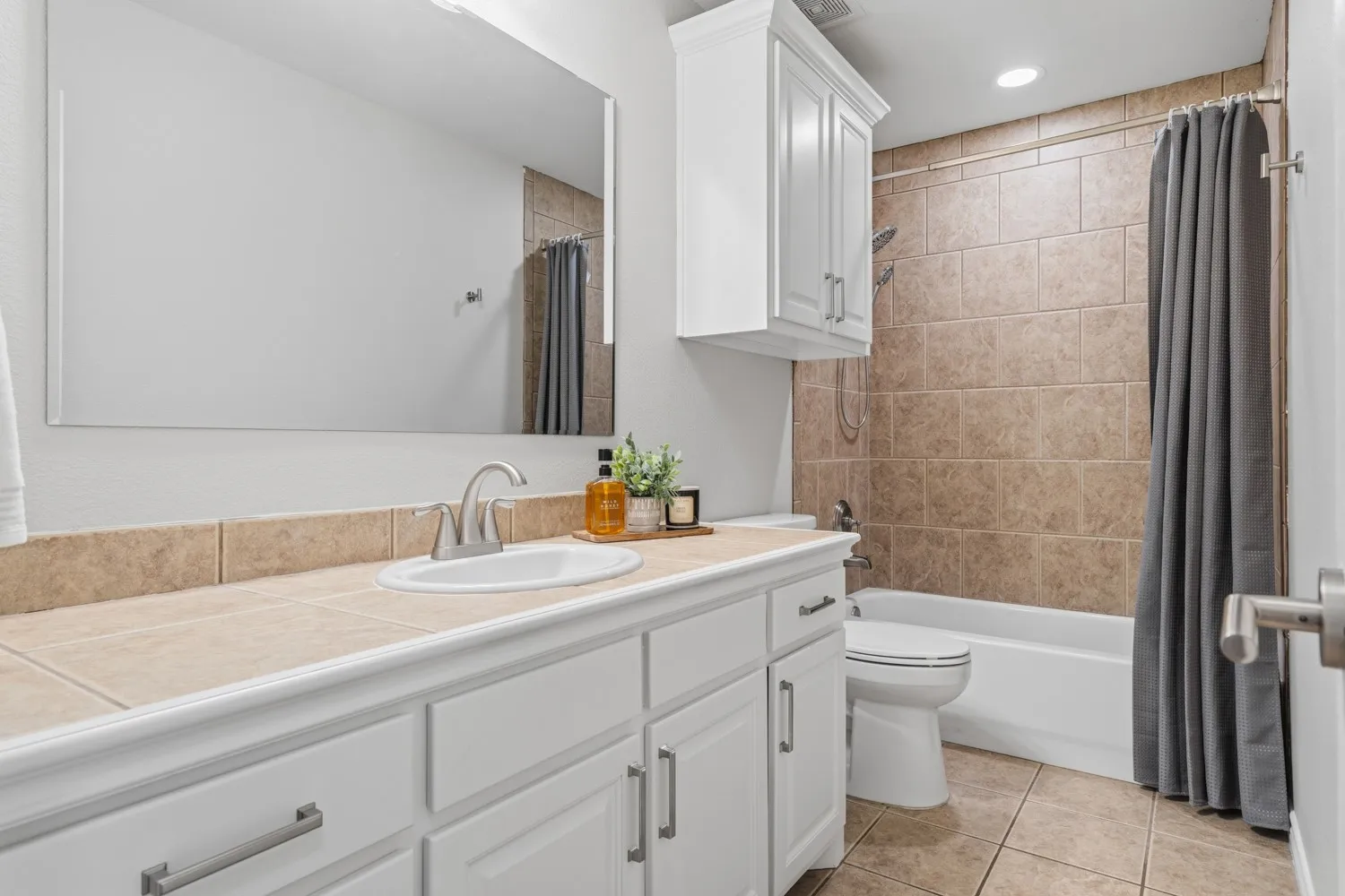 Hall bath with plenty of counter space to share.