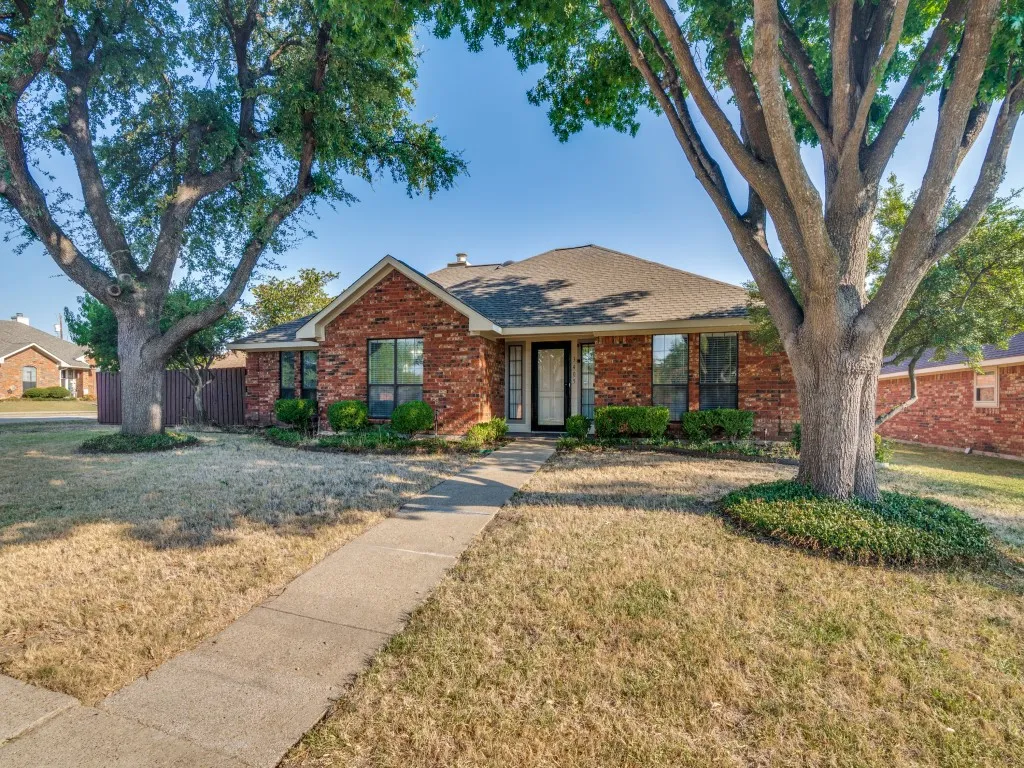 Red brick exterior with dark trim