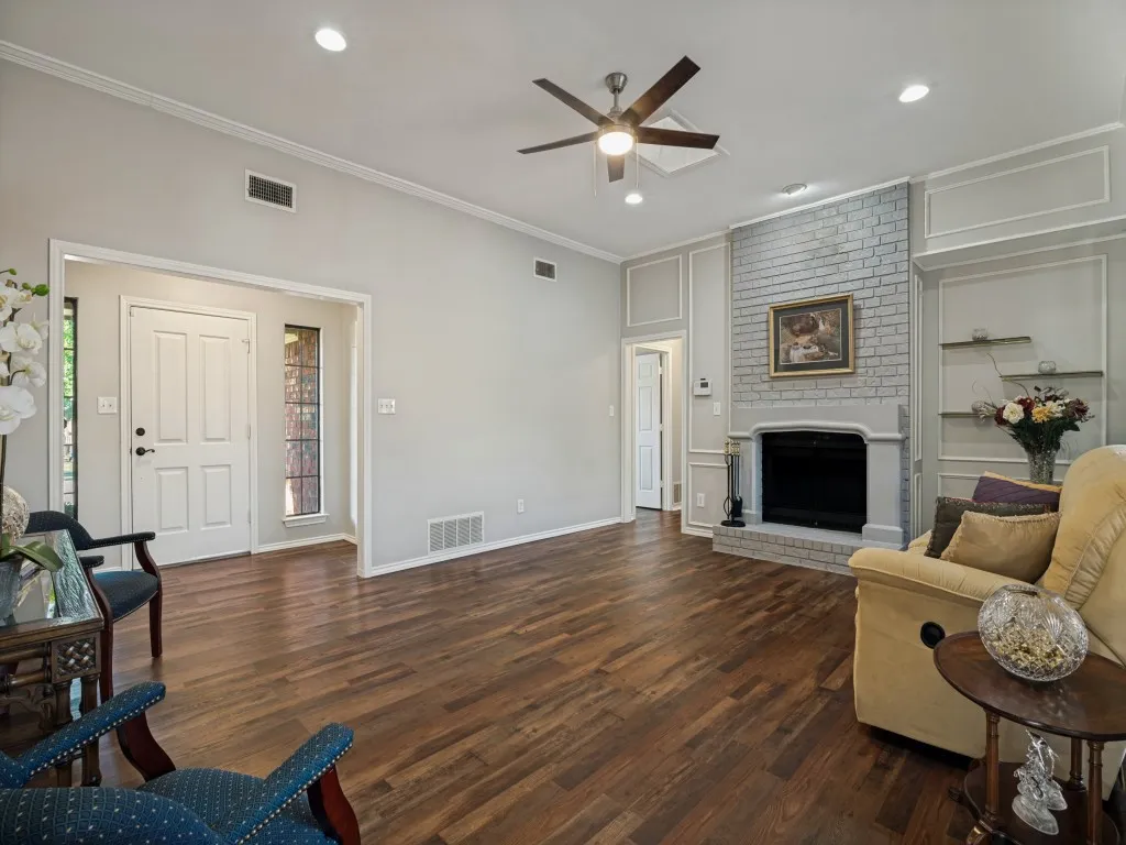 Wood-finish flooring throughout, recessed lighting, and a ceiling fan
