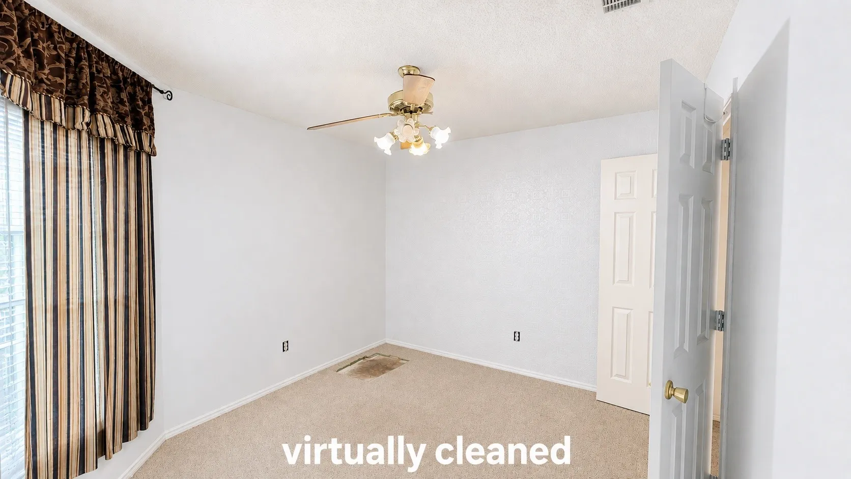 Carpeted room with a ceiling fan light fixture and a window with blinds
