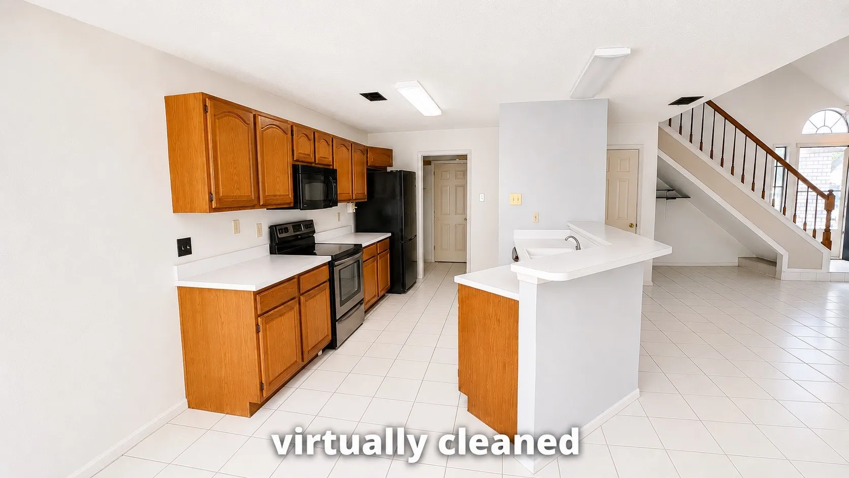 Kitchen with wood-finish cabinetry and white countertops, featuring a built-in microwave, electric range, and refrigerator