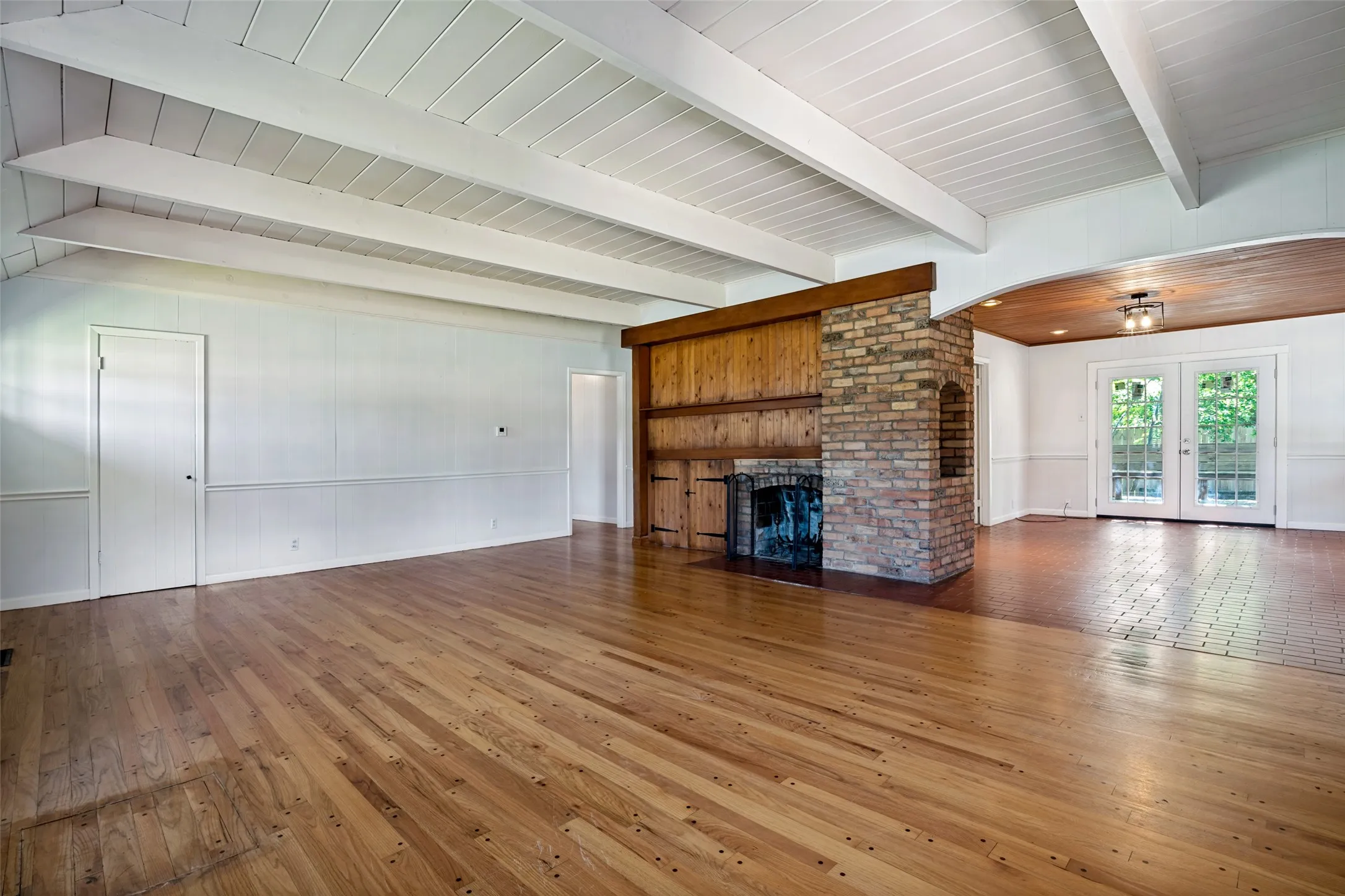 A view of the Dining Area just off the kitchen, with a sweet little Brick Nook - so much architectural appeal in this custom built home!
