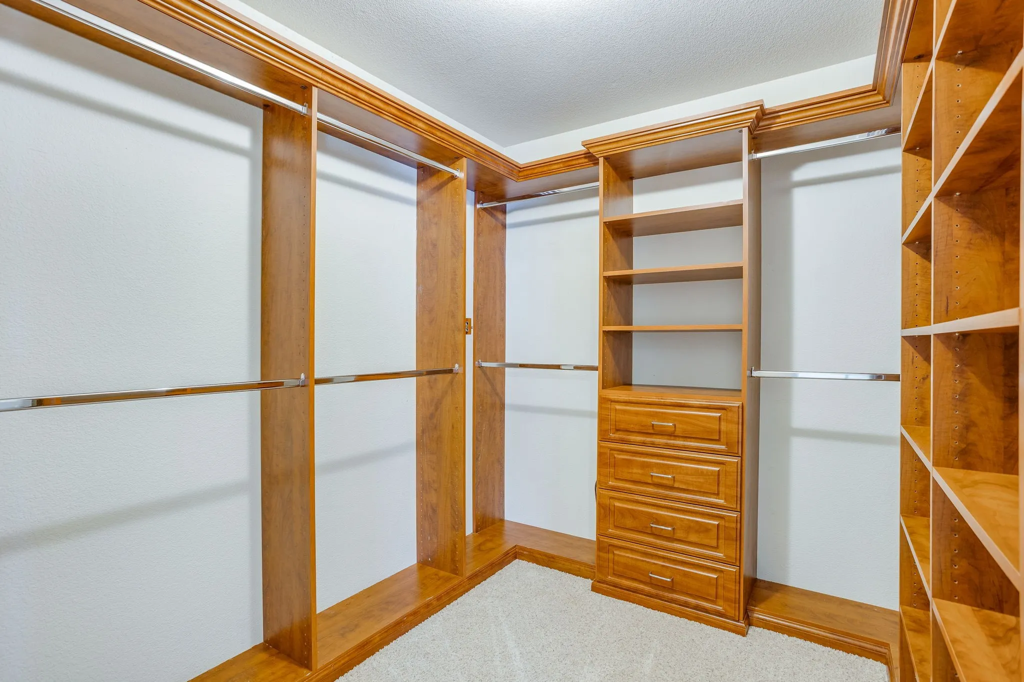 Custom closet in Primary Bedroom.