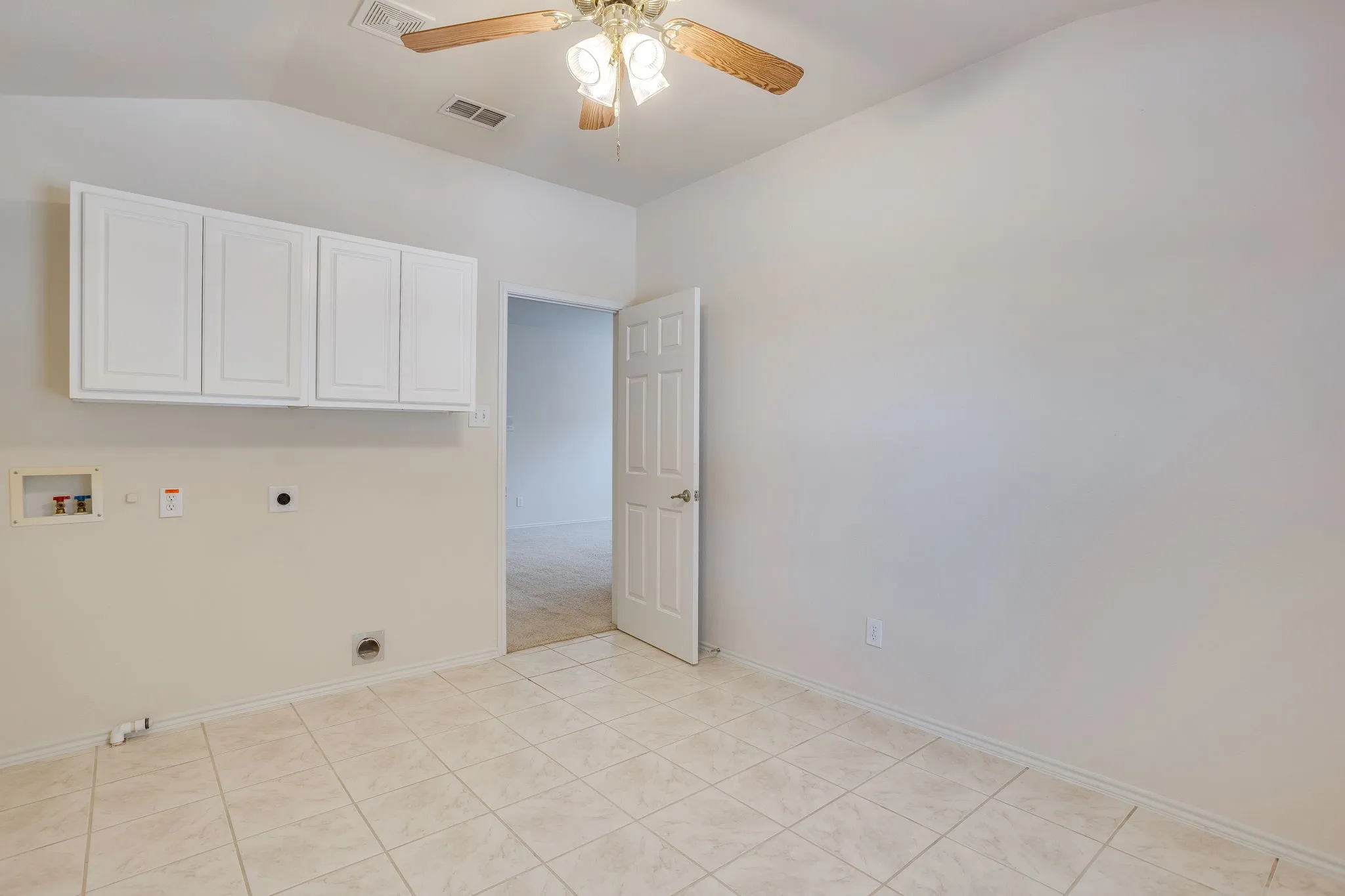 Large tiled Laundry Room convenient to upstairs bedrooms.