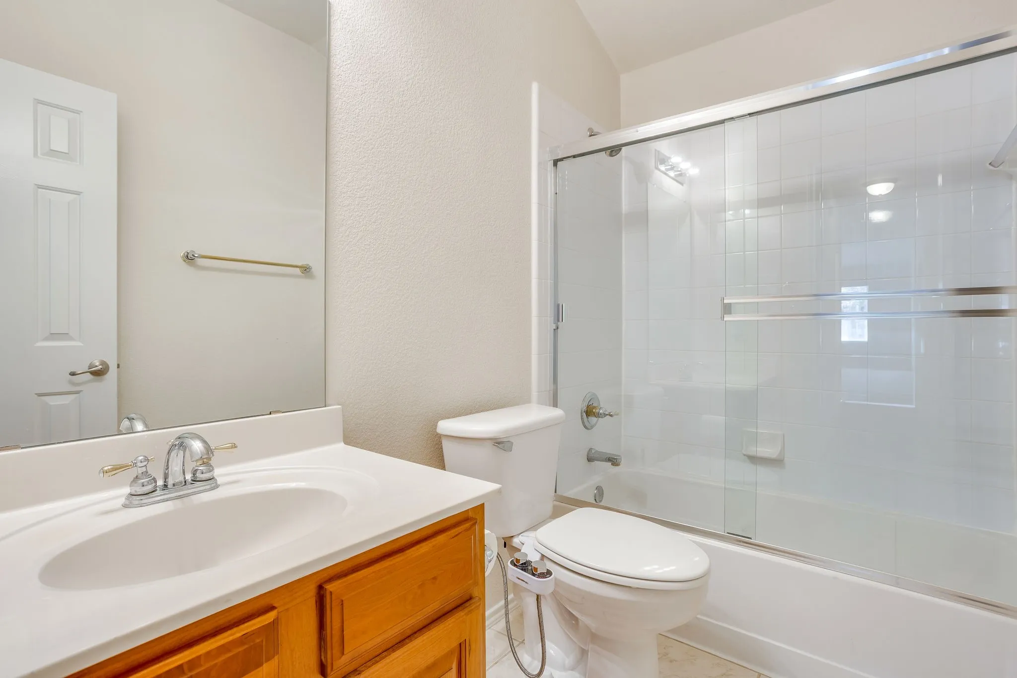 2 of 2 upstairs full bathsinto hallway.
