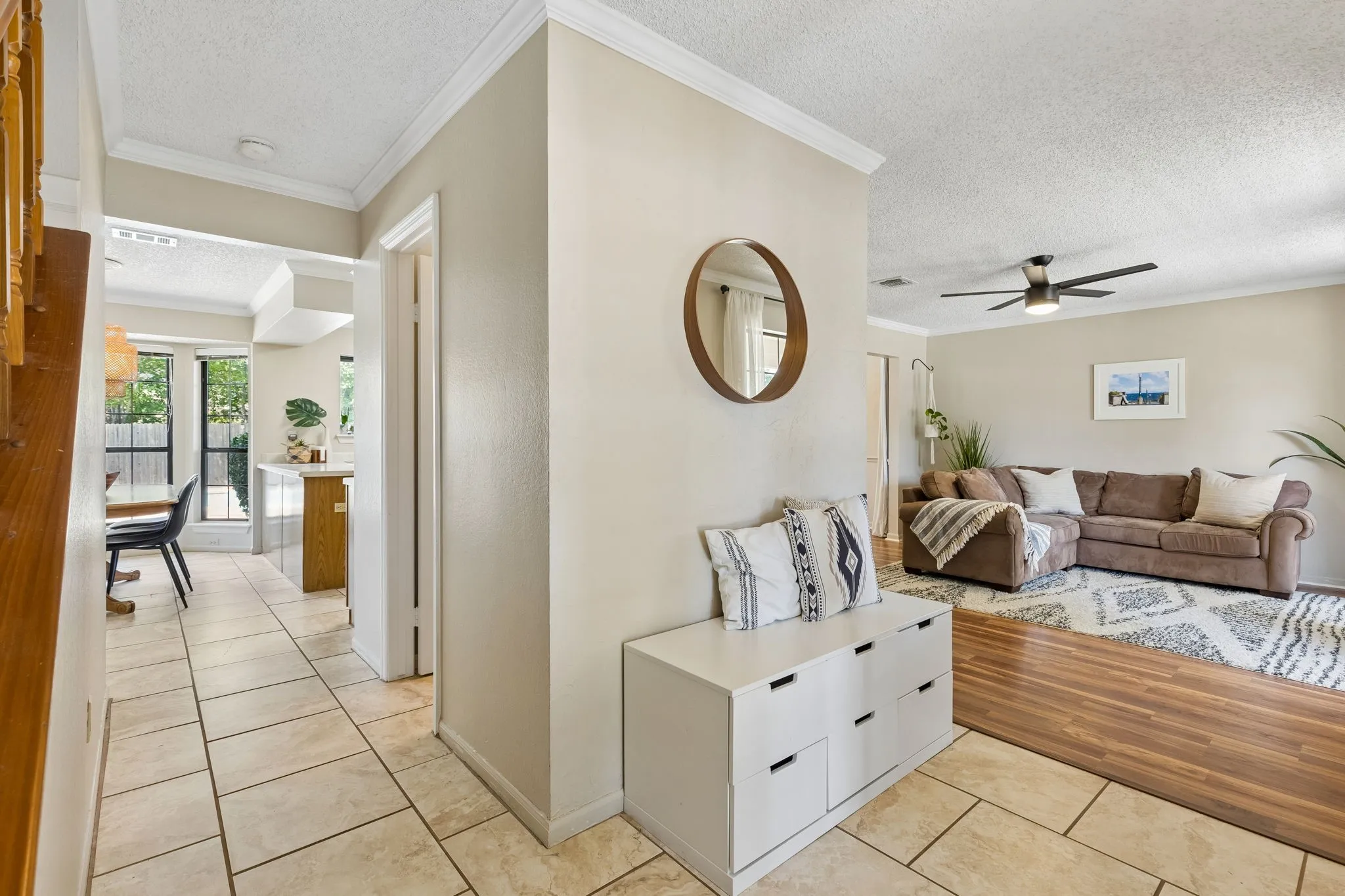Inviting Entry with Tile Flooring, Crown Molding and Open Views into the Living Areas