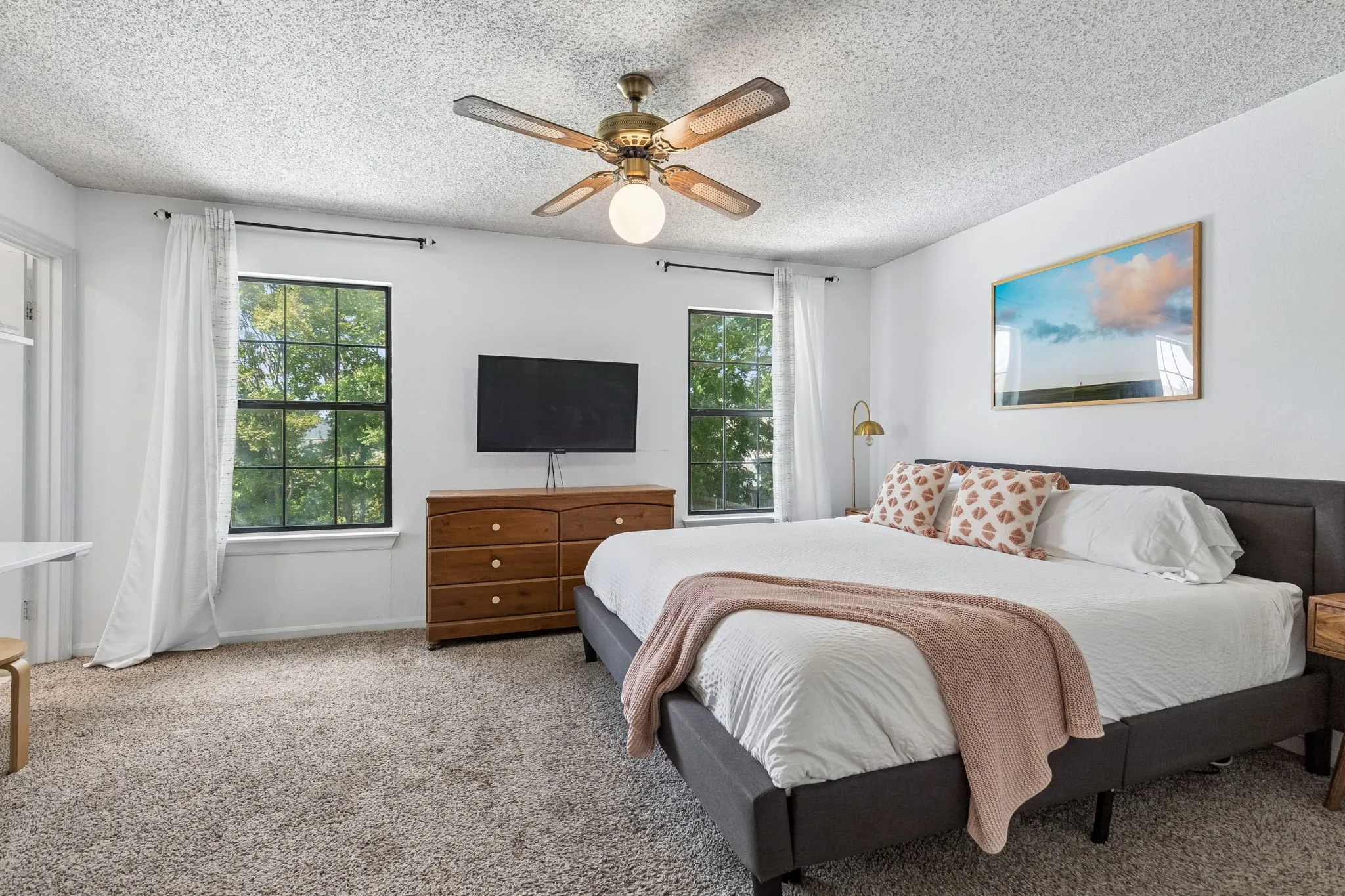 Spacious Primary Bedroom with Multiple Windows, Neutral Carpet and Plenty of Room for Additional Furniture