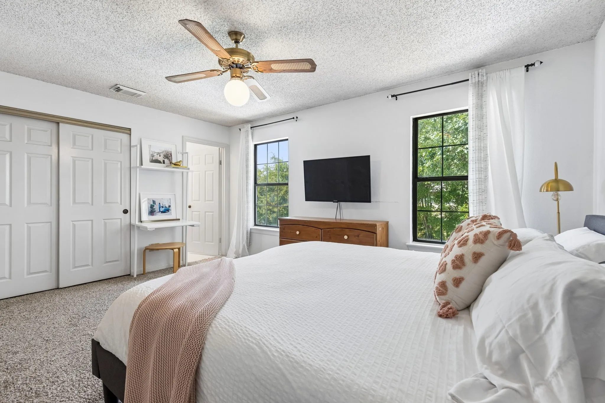 Primary Bedroom with Abundant Natural Light, Multiple Windows and Ample Closet Space