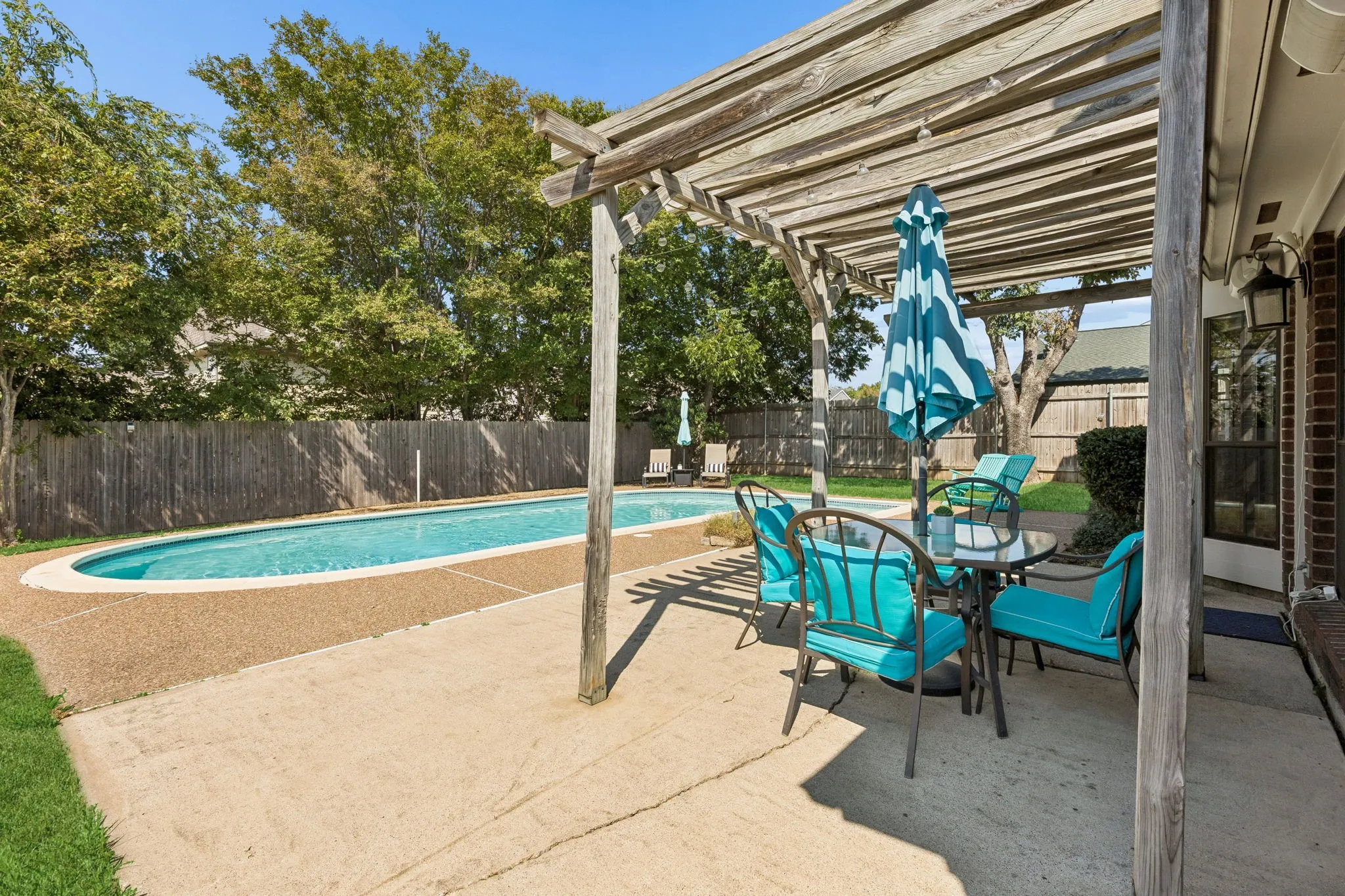 Backyard Patio with Pergola Overlooking the Private Swimming Pool