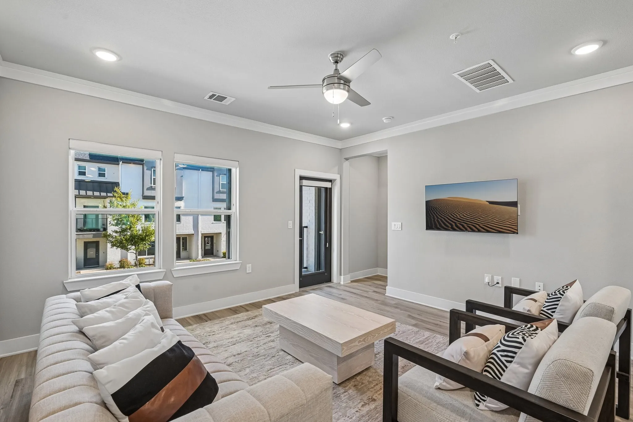 Recessed lighting, crown molding, and wood-finish flooring