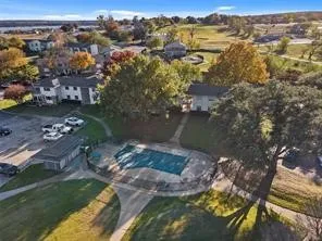 Community features including a swimming pool, covered parking, and multi-unit residences