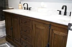 Dual vanity with a white countertop and integrated sinks