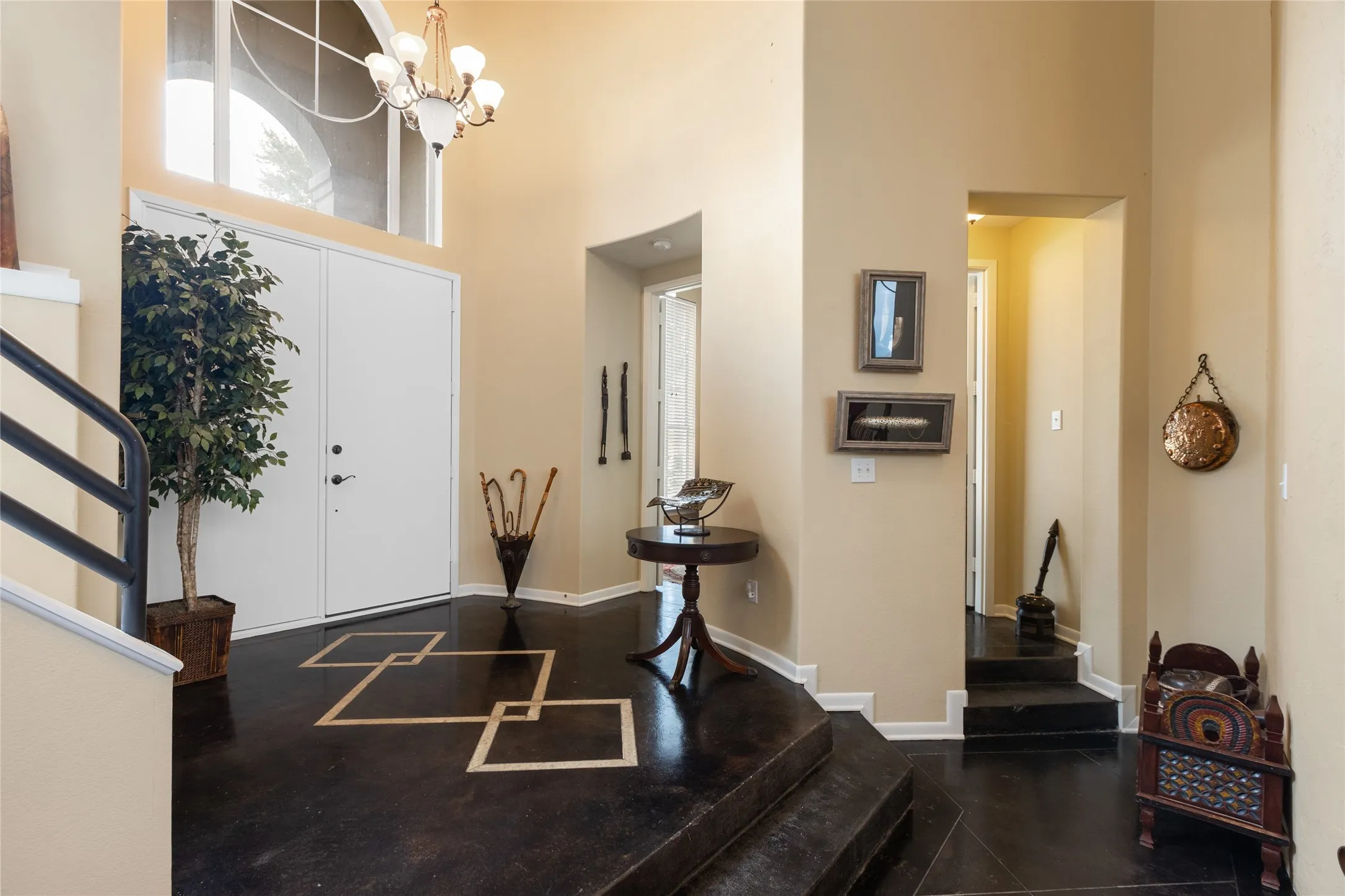 Grand entry with Stained Concrete Floors with Tall Ceiling
