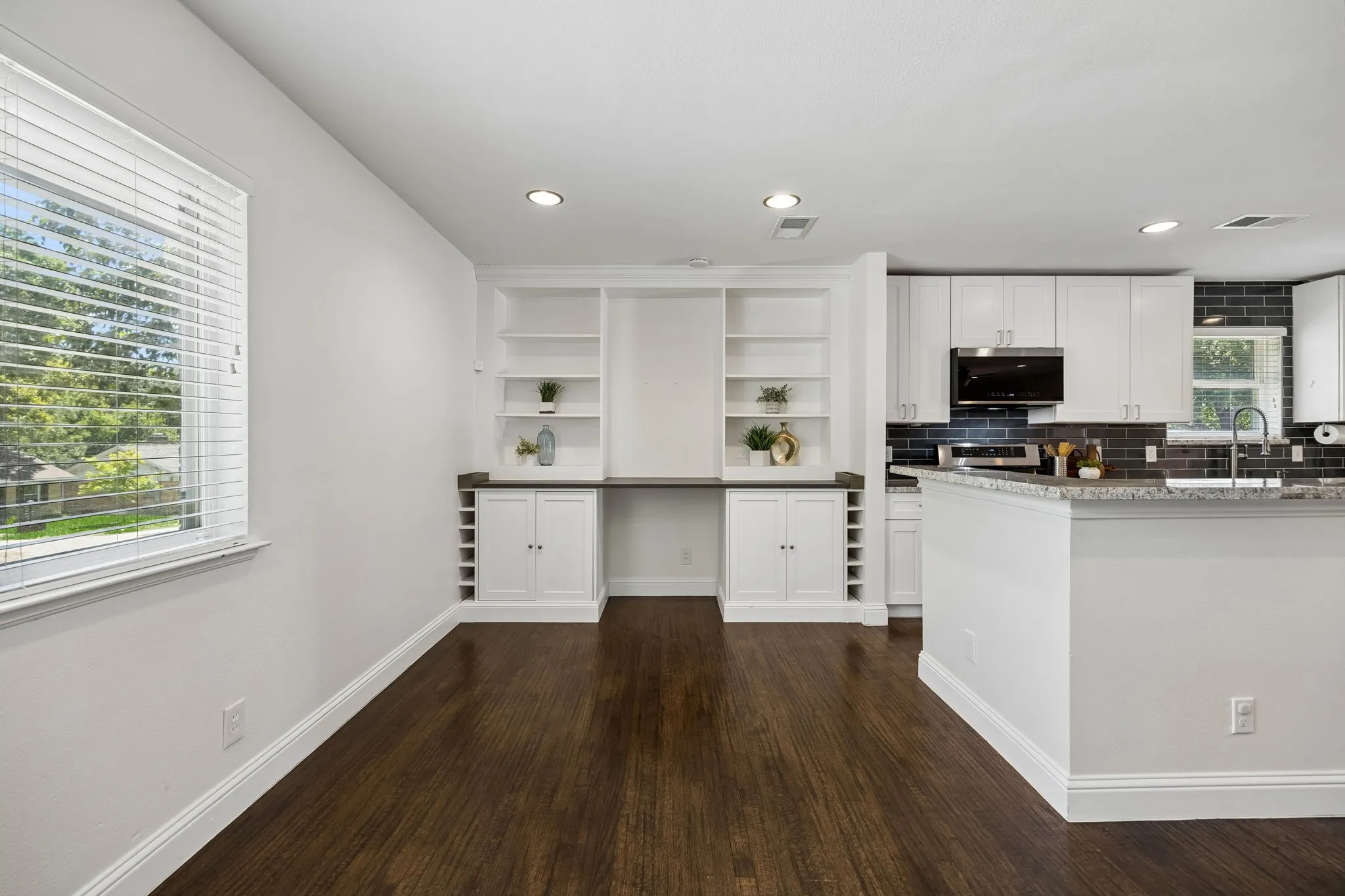 Large windows bathe the dining space with abundant natural light