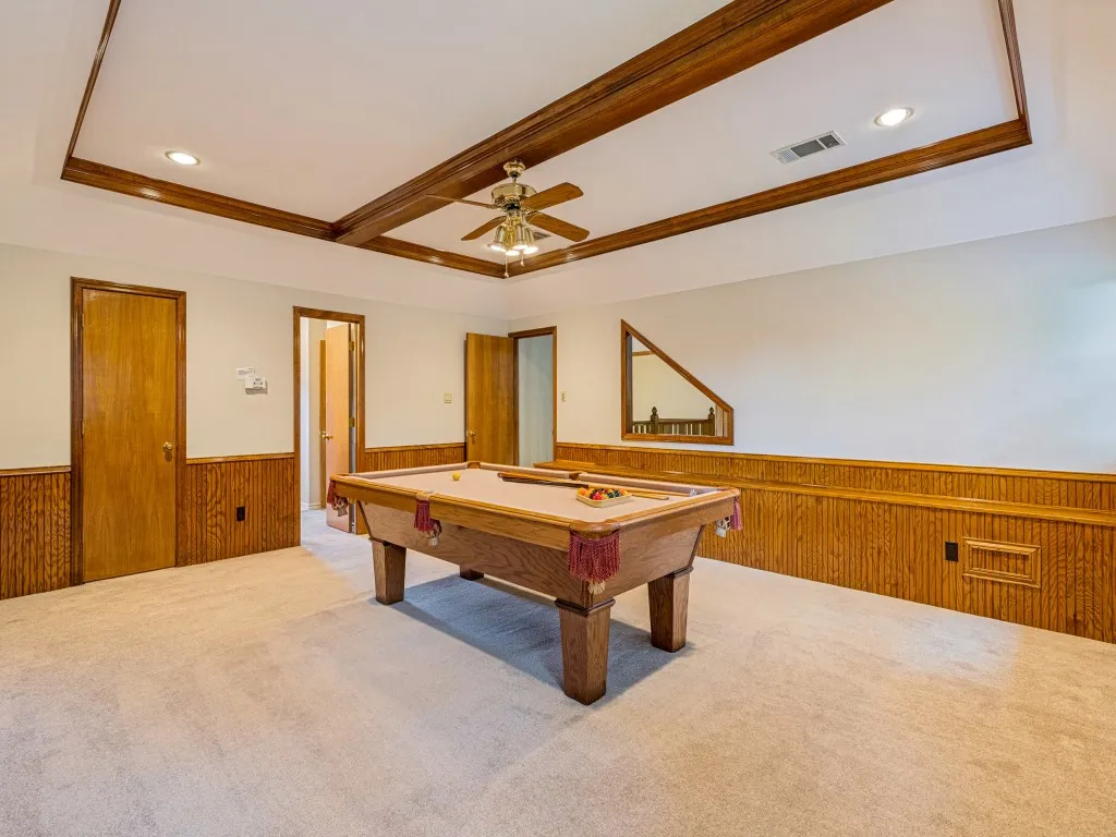 Game room with large closet and entry to bathroom.