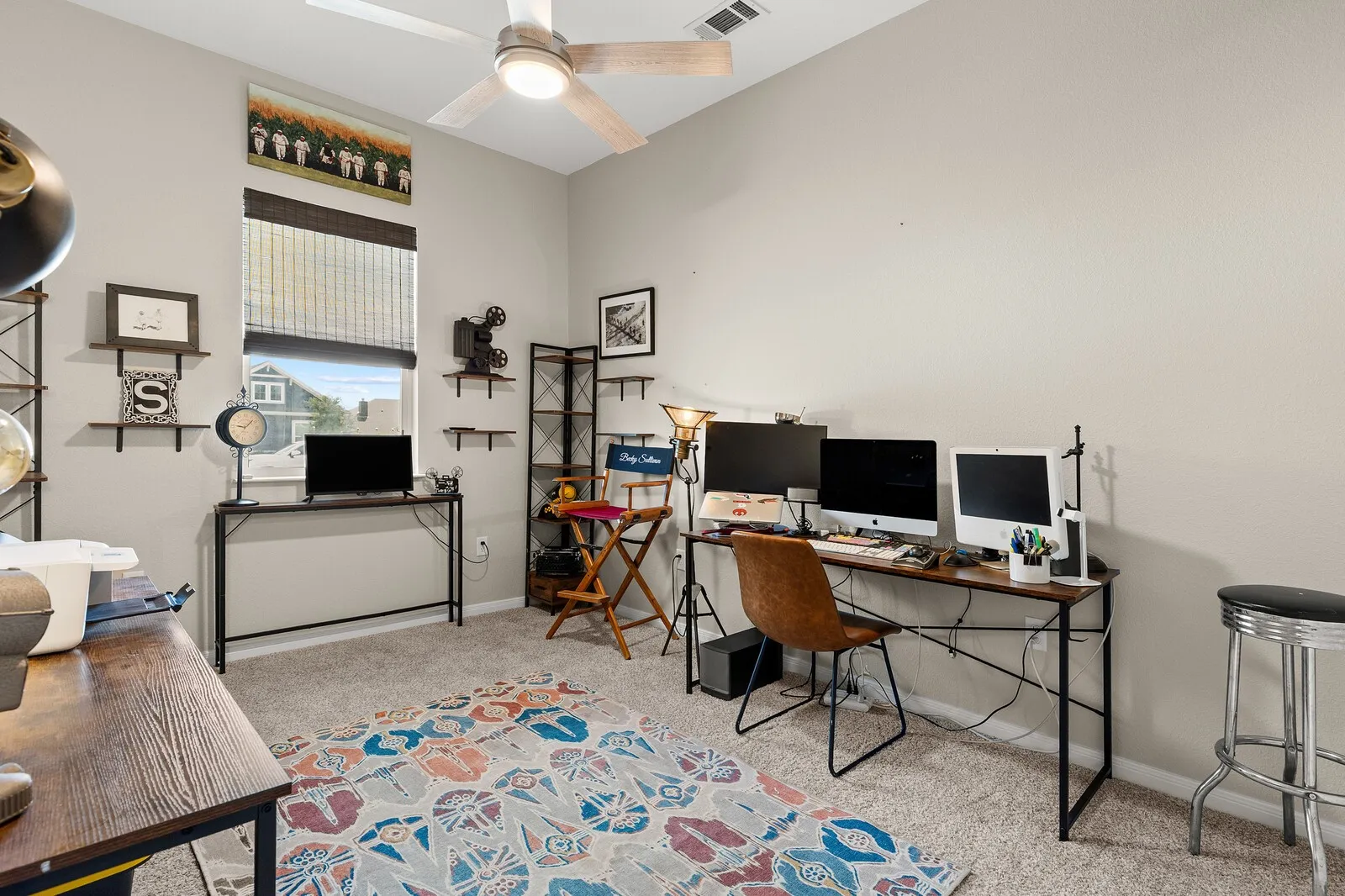 Carpeted flooring, vaulted ceiling, and a ceiling fan with integrated lighting