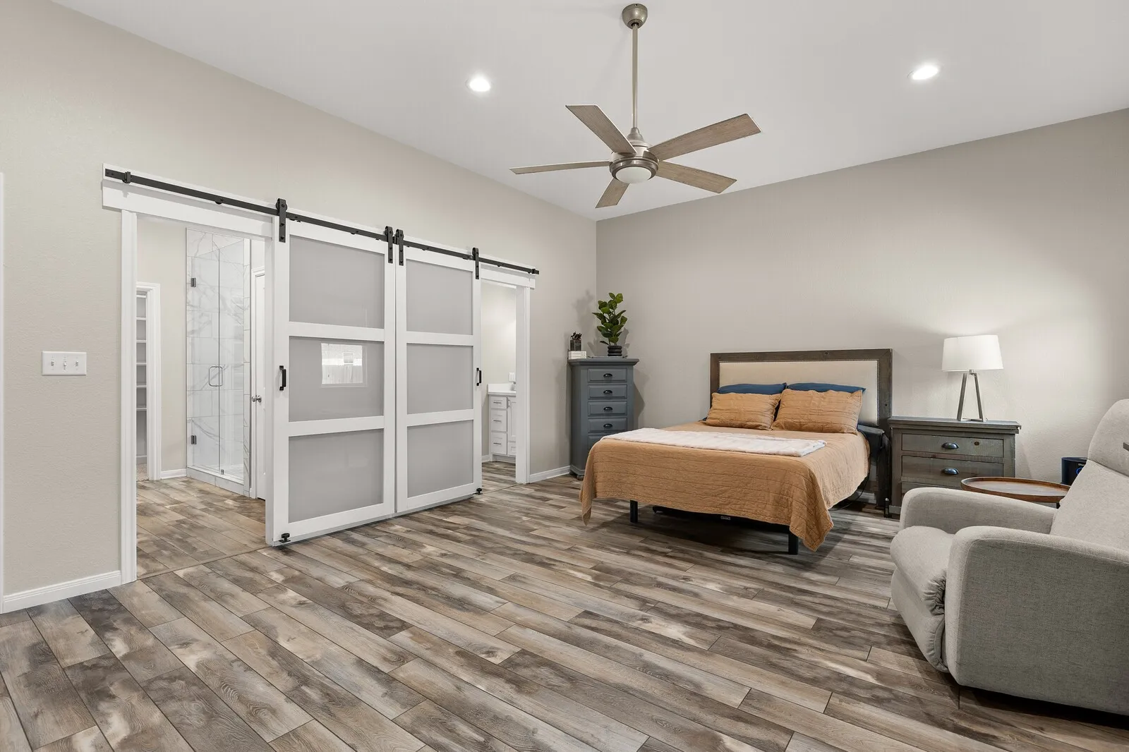 Wood-finish flooring, recessed lighting, and a ceiling fan