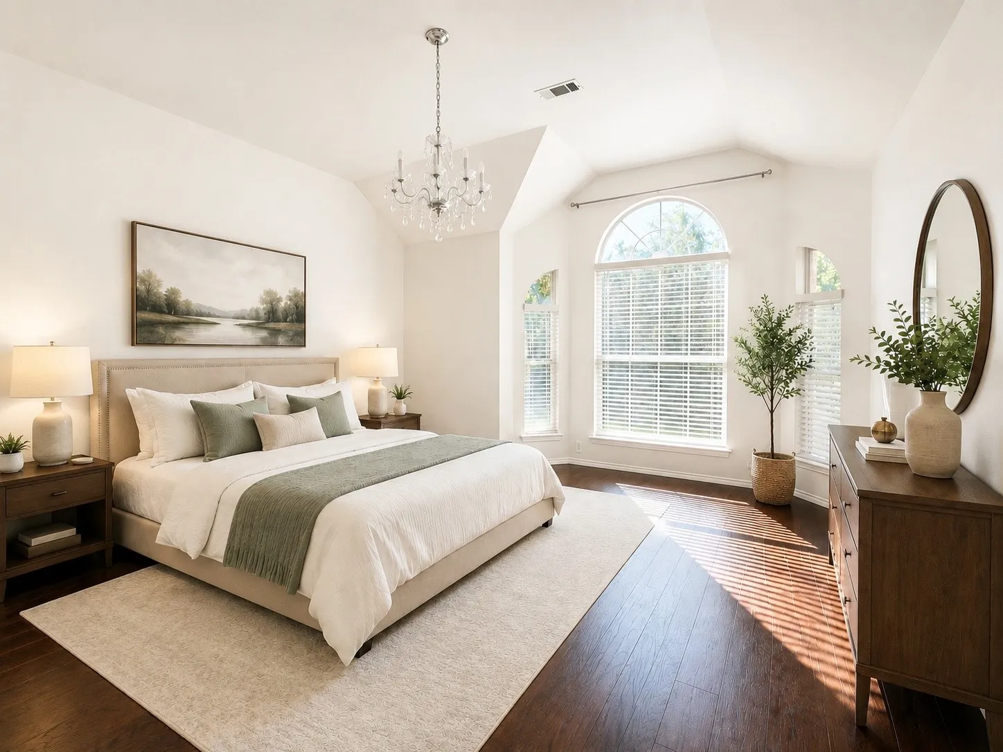 Vaulted ceiling with an elegant chandelier, arched windows, and dark wood-finish flooring