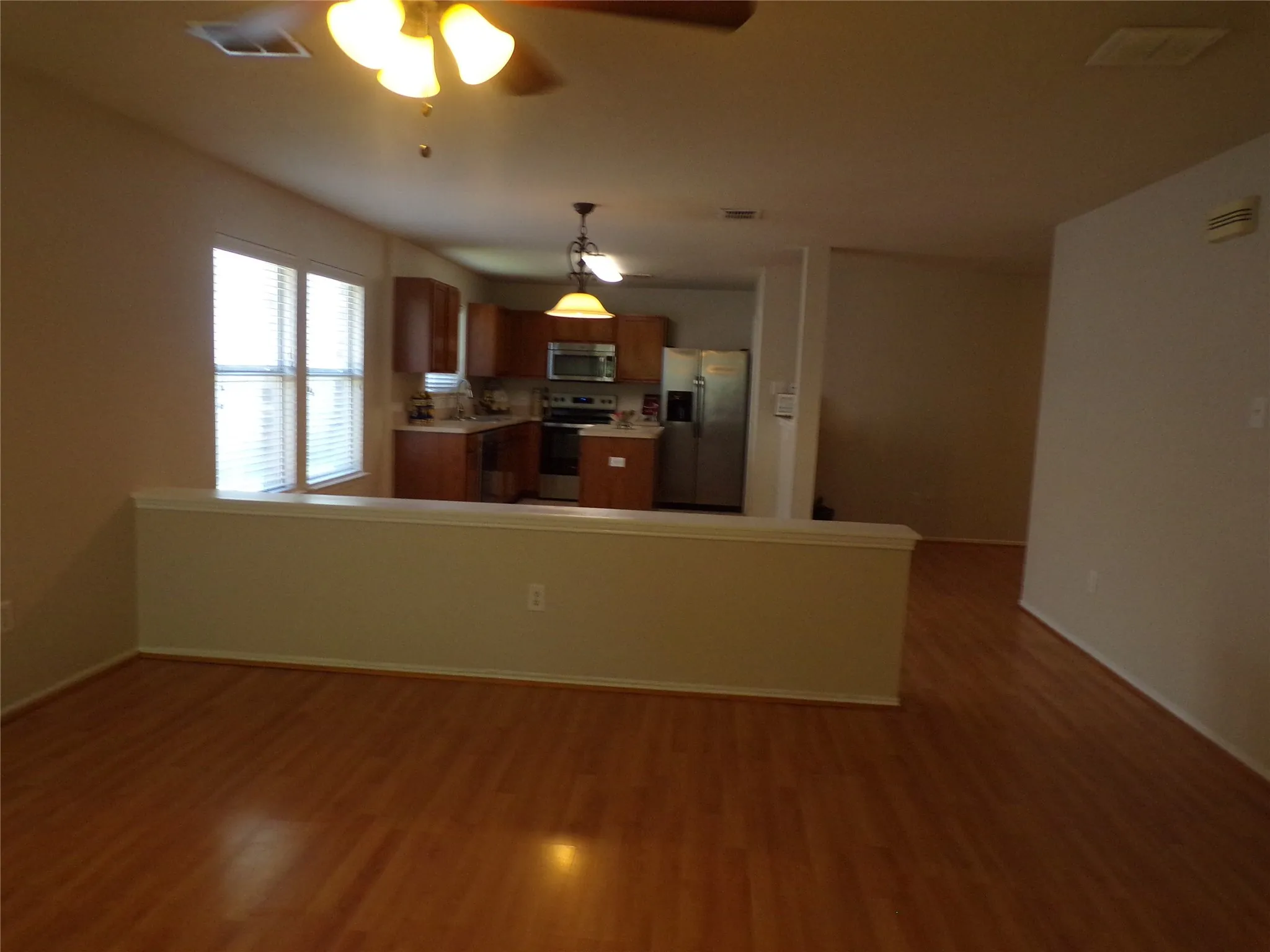 View from living area into breakfast nook and kitchen