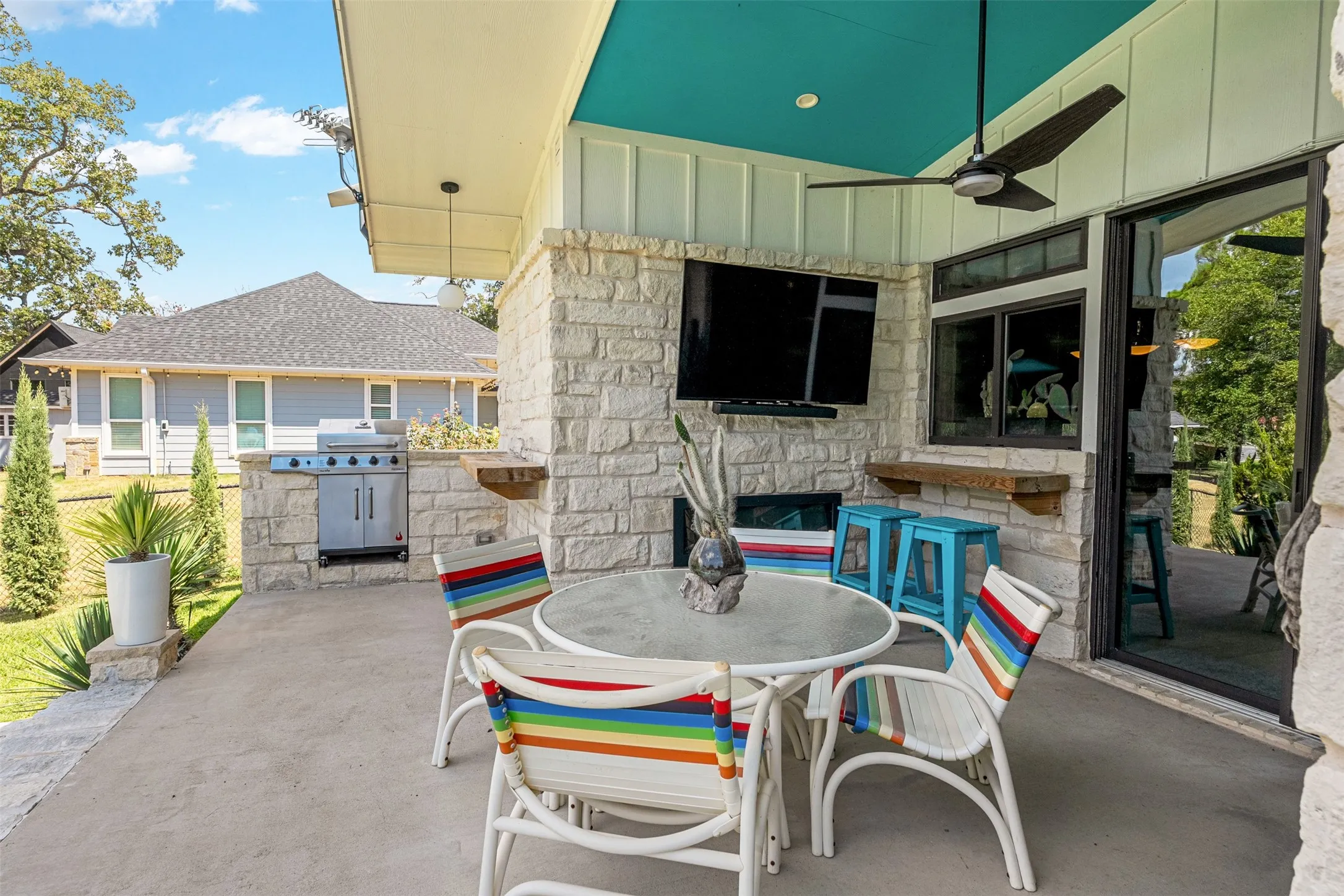 Covered patio, new grill, pass-thru window off garage lounge