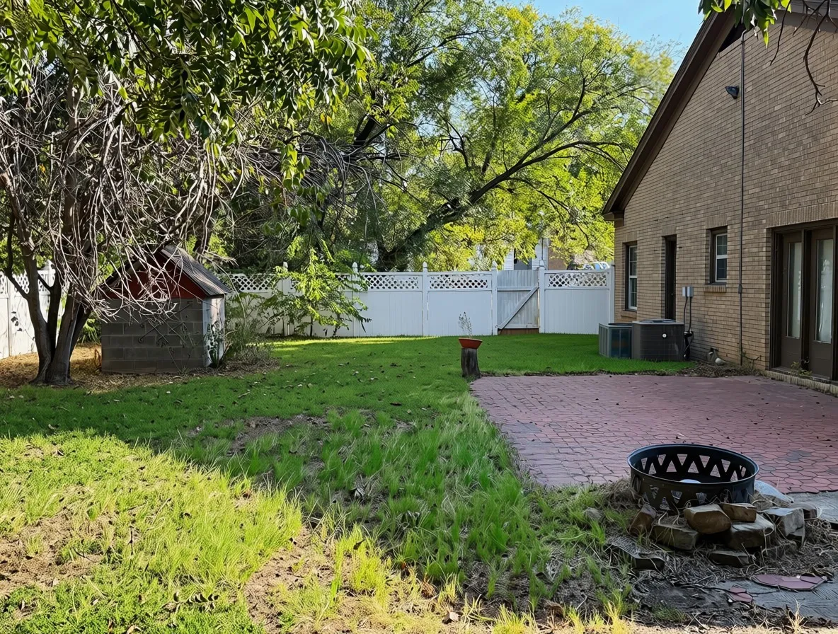 Brick exterior with multiple entry points, red paver patio, and white lattice fencing