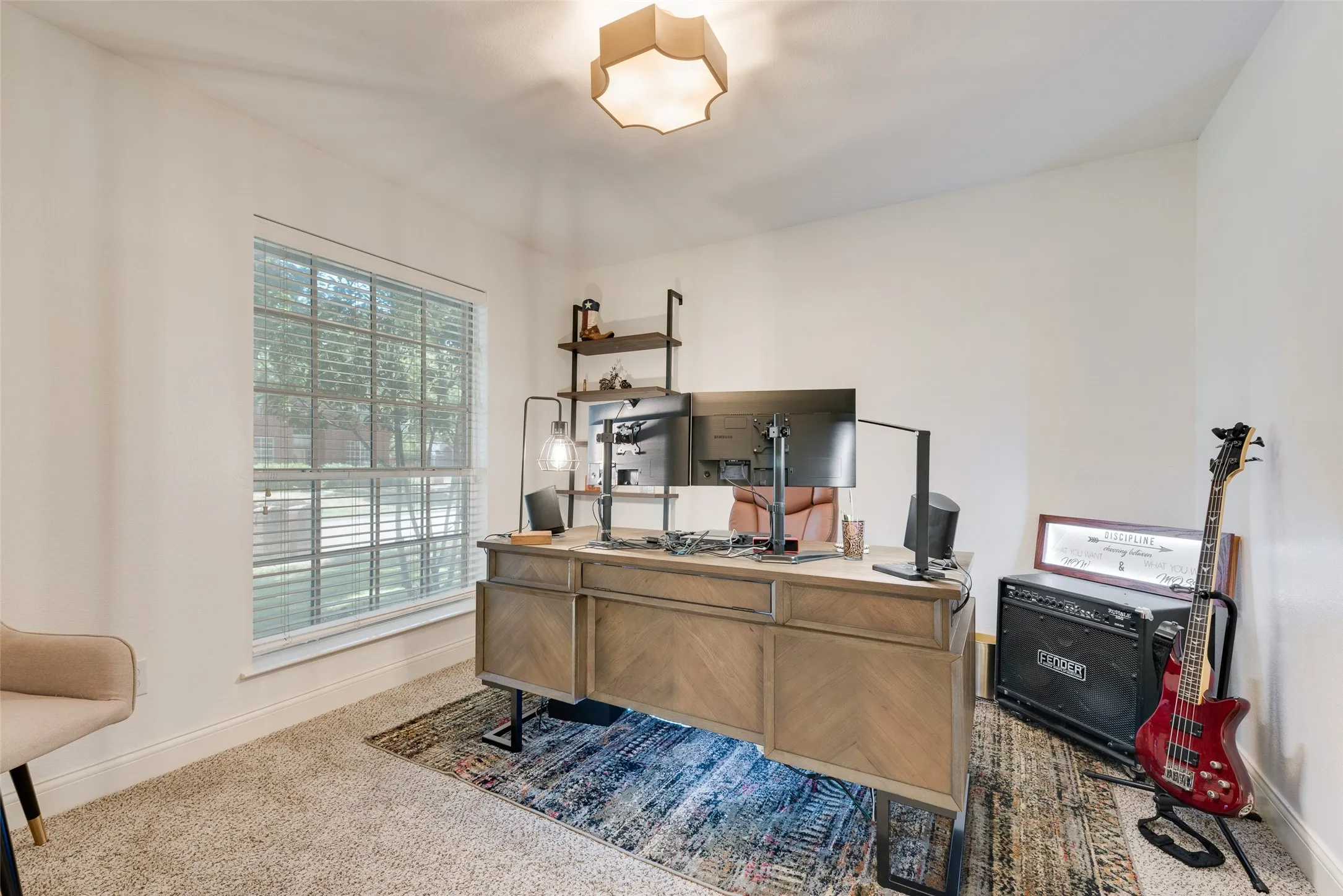 Recessed lighting fixture, carpeted flooring, large window with blinds, and white wall finishes