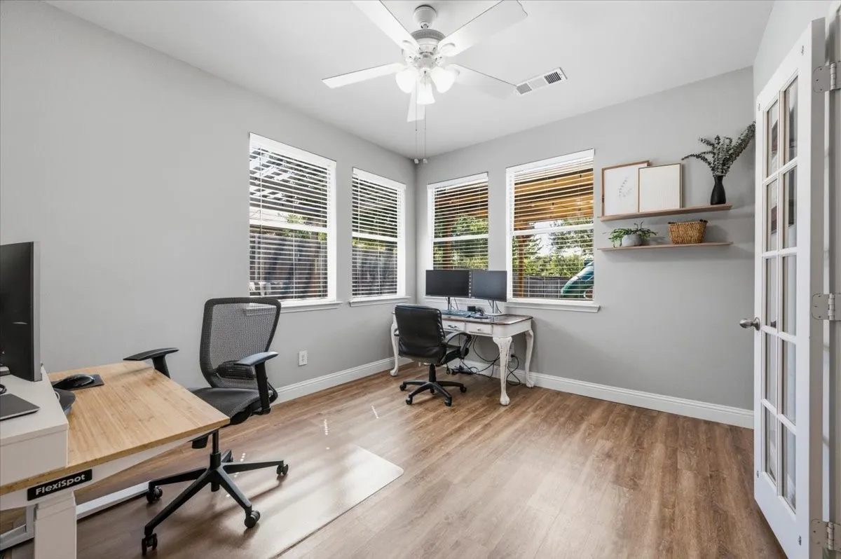 Just off the primary bedroom with plenty of natural light. Currently used as an office. Flexible space for a nursery or hobby area or reading room.